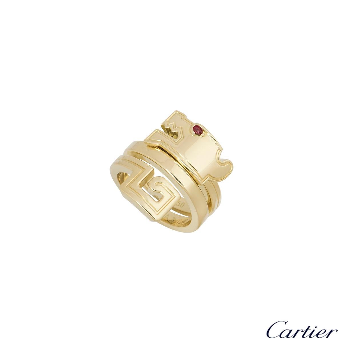 A stunning 18k yellow gold Cartier ring from the Le Baiser Du Dragon collection. The ring features a dragon head with a ruby eye on one end which wraps round the finger and ends with the tail. The ring is a size UK M, EU 52 and US 6 with a gross