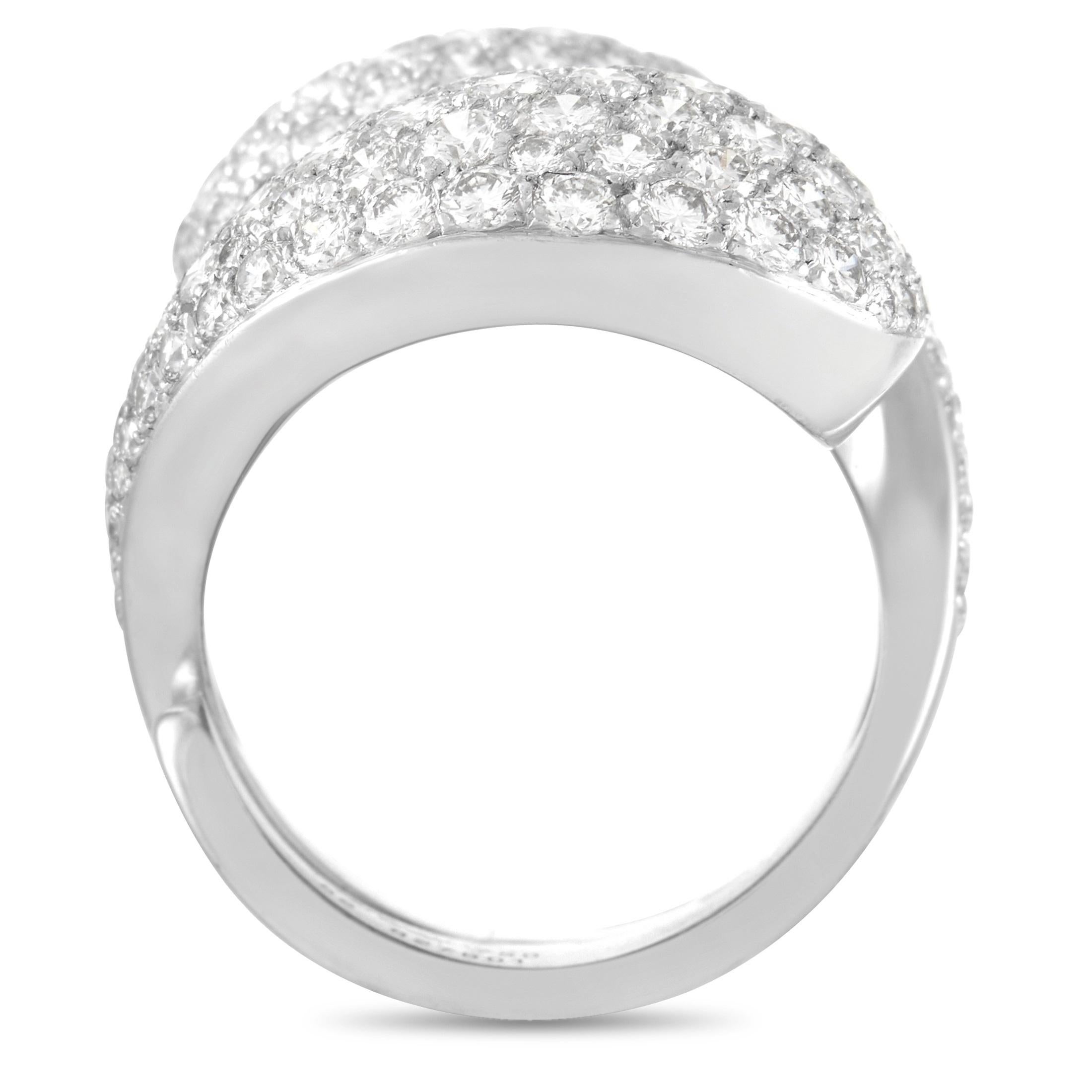 The classic concept of Yin and Yang comes to life on this iconic Cartier Le Yin et Le Yang ring. Pave diamonds totaling 5.25 carats with E color and VVS1 clarity cover the top of this elegant, simplistic design, which pairs glittering gemstones with