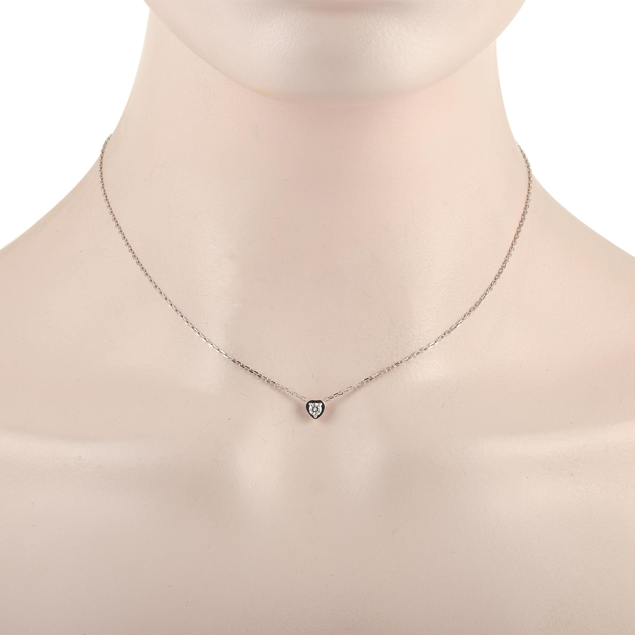 This classic Cartier 18K White Gold 0.20 ct Diamond Leger de heart Necklace is made with an 18K white gold chain which highlighting a white gold heart pendant set with a single round-cut 0.20 carat diamond. The dainty chain measures 1.5 inches in