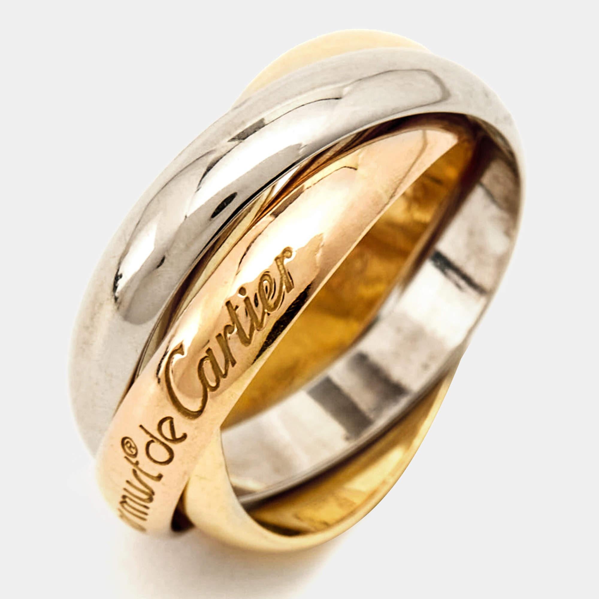 The Cartier Les Must de Cartier ring is an exquisite piece crafted in luxurious 18k yellow, white, and rose gold. With an iconic Cartier design, it features a seamless blend of elegance and sophistication, making it a timeless and coveted