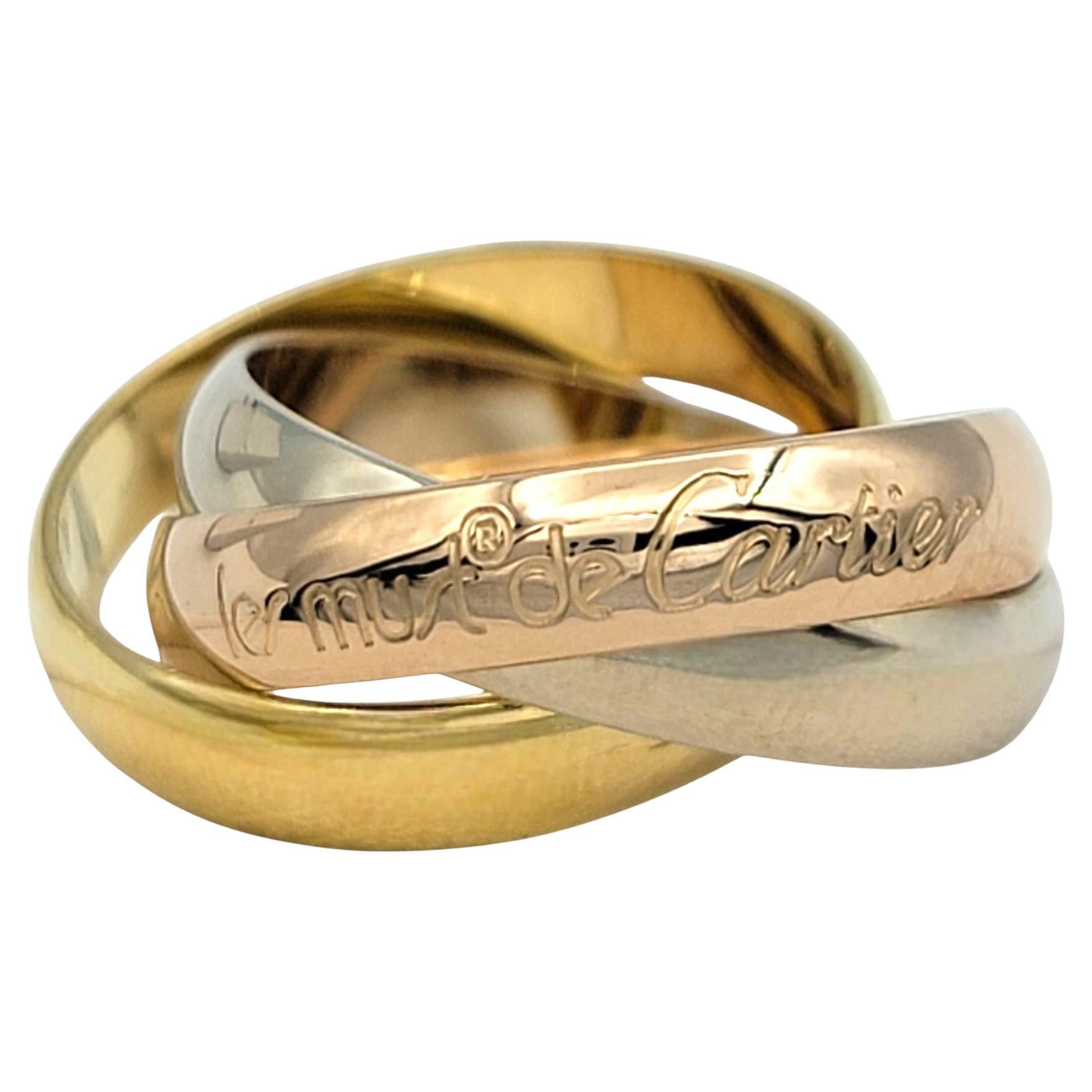Misura dell'anello: 46 EU o 3 3/4 US.

Questo iconico anello a fascia Trinity 