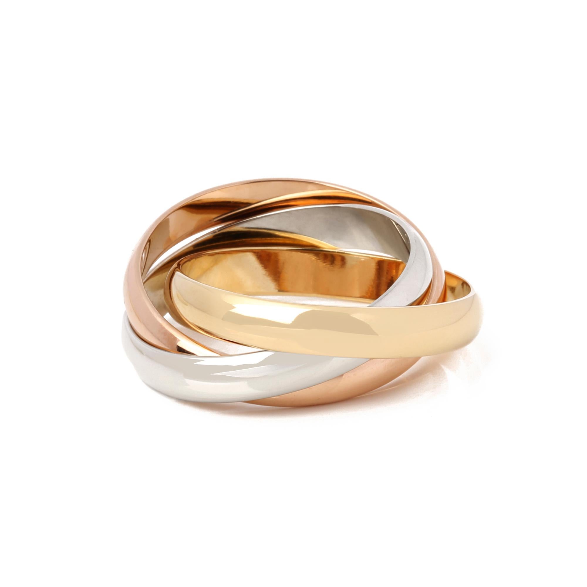 This ring by Cartier is from their Trinity collection and features 18k yellow, white and rose gold interlinking bands. UK ring size L. EU ring size 51. US ring size 6. This ring cannot be resized. Complete with a Xupes presentation box. Our Xupes