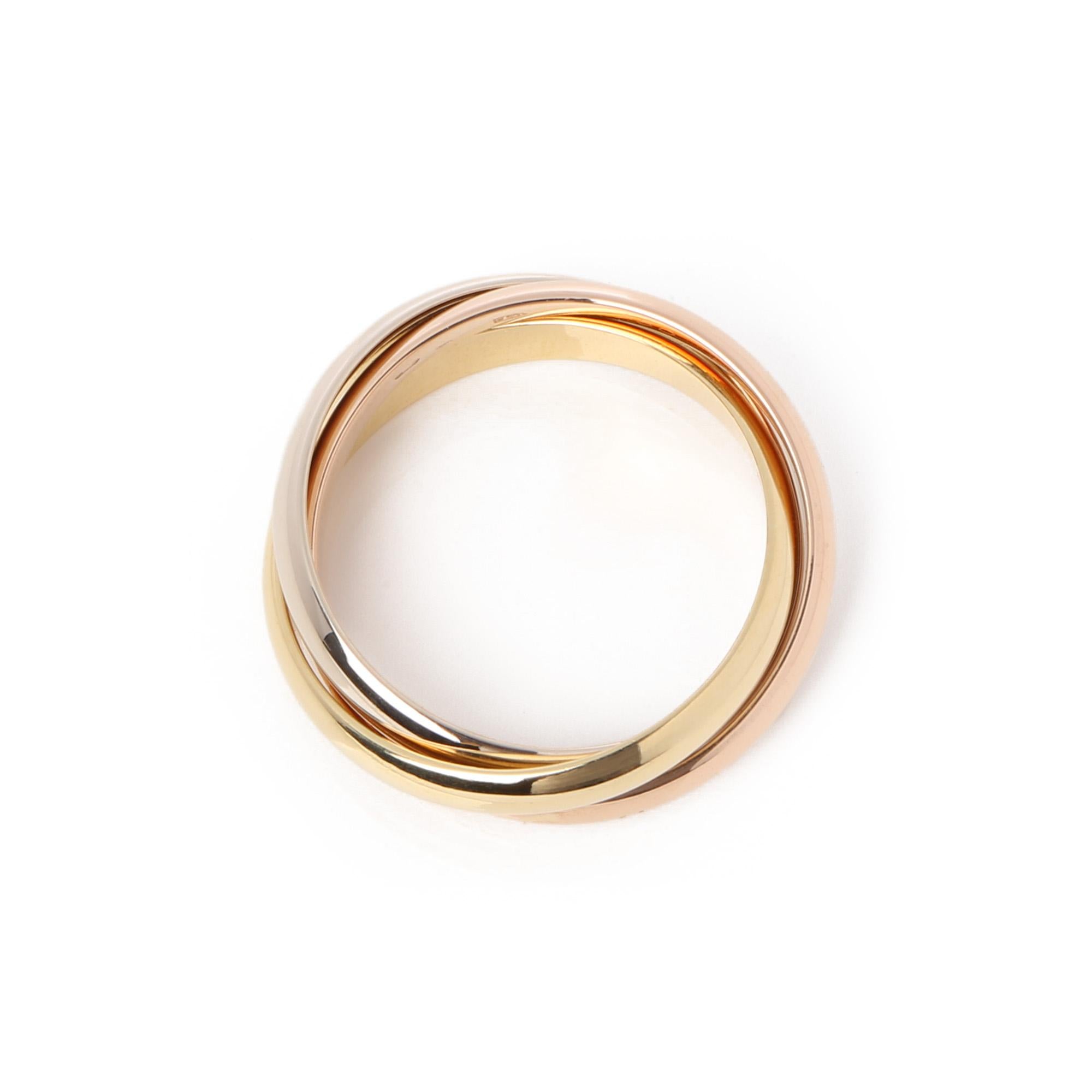 This ring by Cartier is from their Must De Cartier Trinity collection and features 18ct yellow, white and rose gold interlinking bands. UK ring size P. EU ring size 57. US ring size 8. This ring cannot be re sized. Complete with a Xupes presentation