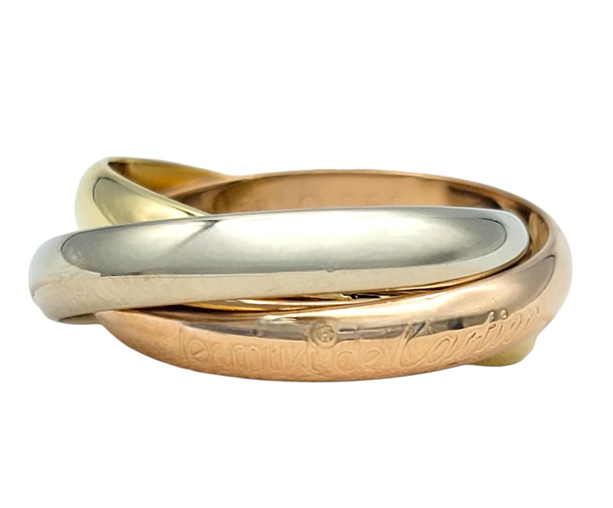 Ring Size: 58 EU / US 8.25 

Discover the elegance of the iconic Cartier Trinity Ring, a masterpiece of enduring style and symbolism. This exquisite design intertwines three bands of 18-karat gold—radiant yellow gold symbolizing fidelity, cool white