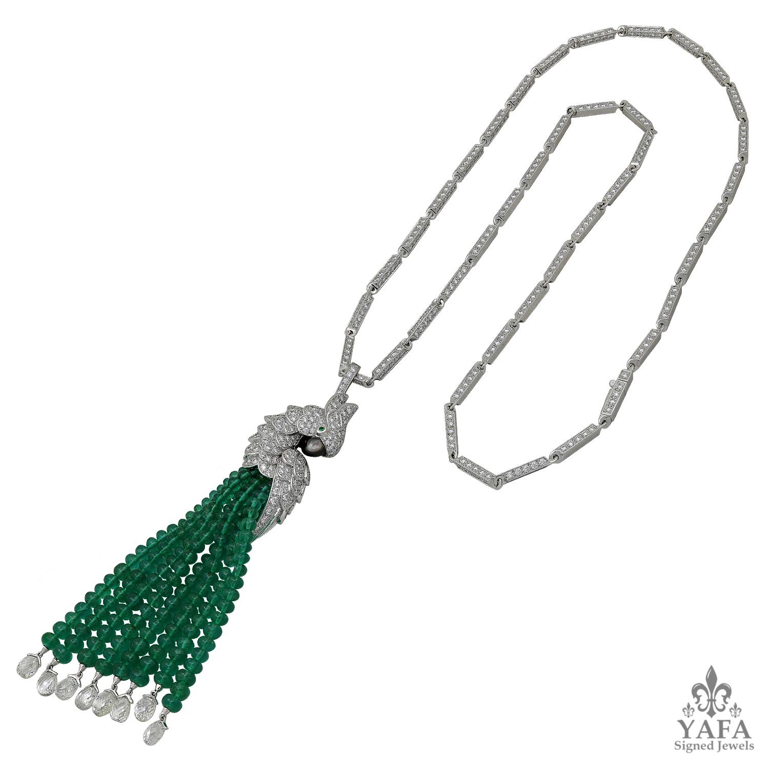 CARTIER “Les Oiseaux Liberes” Pendant Necklace
Designed as a parrot set with brilliant-cut diamonds, highlighted with emerald eyes and mother-of-pearl beak, suspending a tassel of emerald beads with diamond briolette terminals, to the brilliant-cut