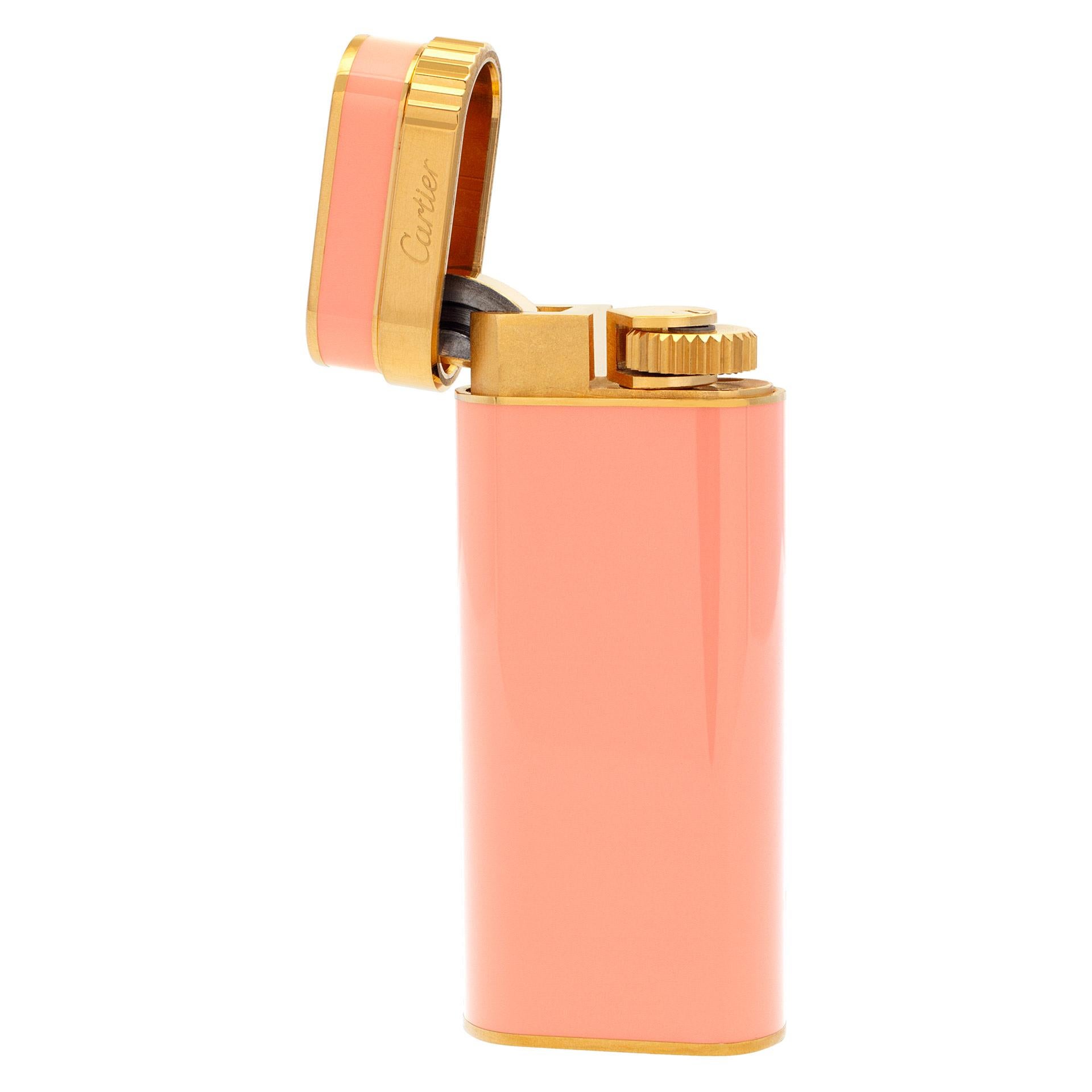 Cartier lighter in baby pink color. Great gift for a lady! Comes with pouch and service papers from Cartier dated 2019.
