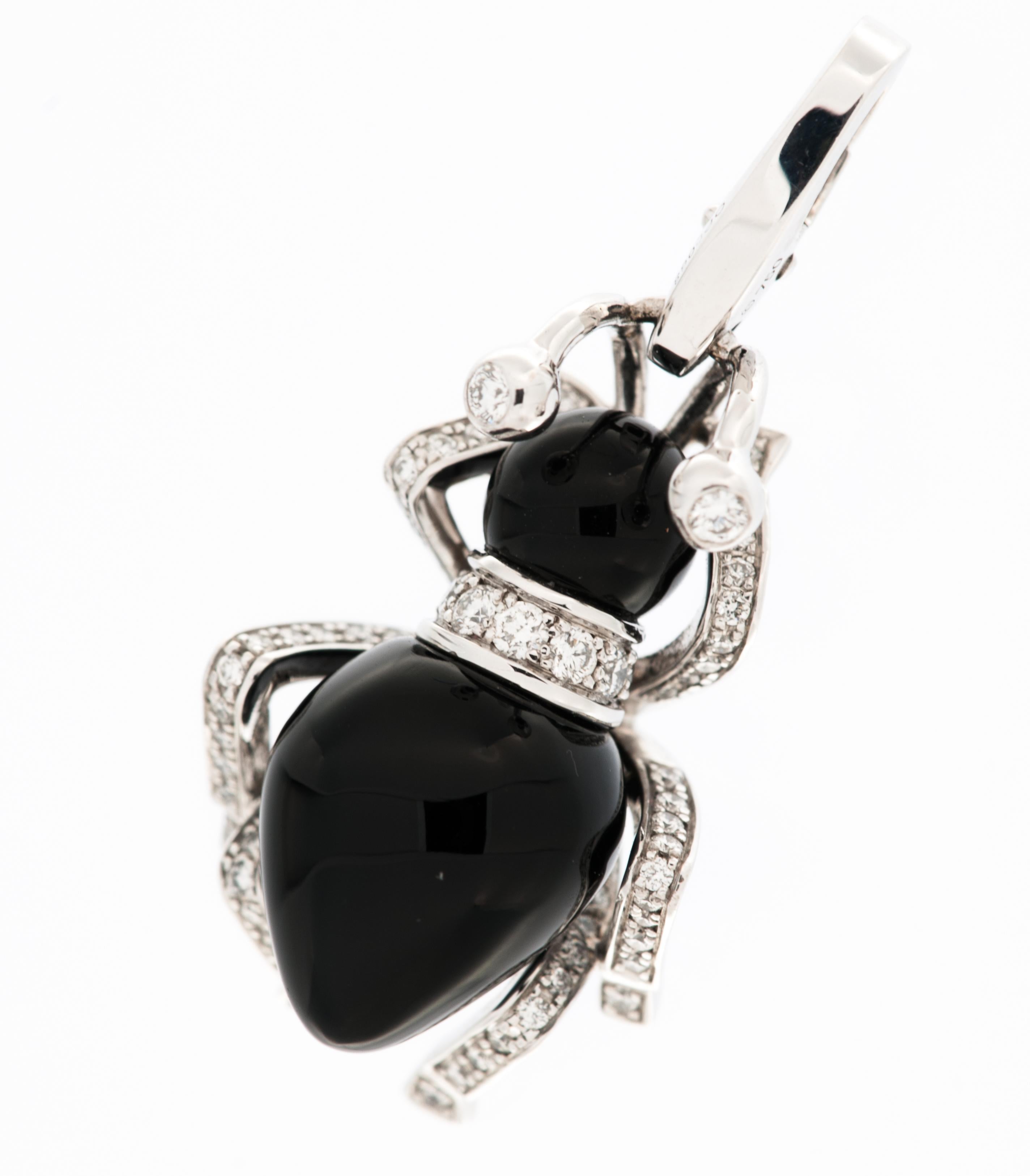 The Cartier Limited Edition Ant Charm with Diamonds and Onyx is a captivating and exclusive piece of jewelry that combines playful charm with luxurious craftsmanship.

Crafted by the renowned house of Cartier, the charm is designed in the shape of