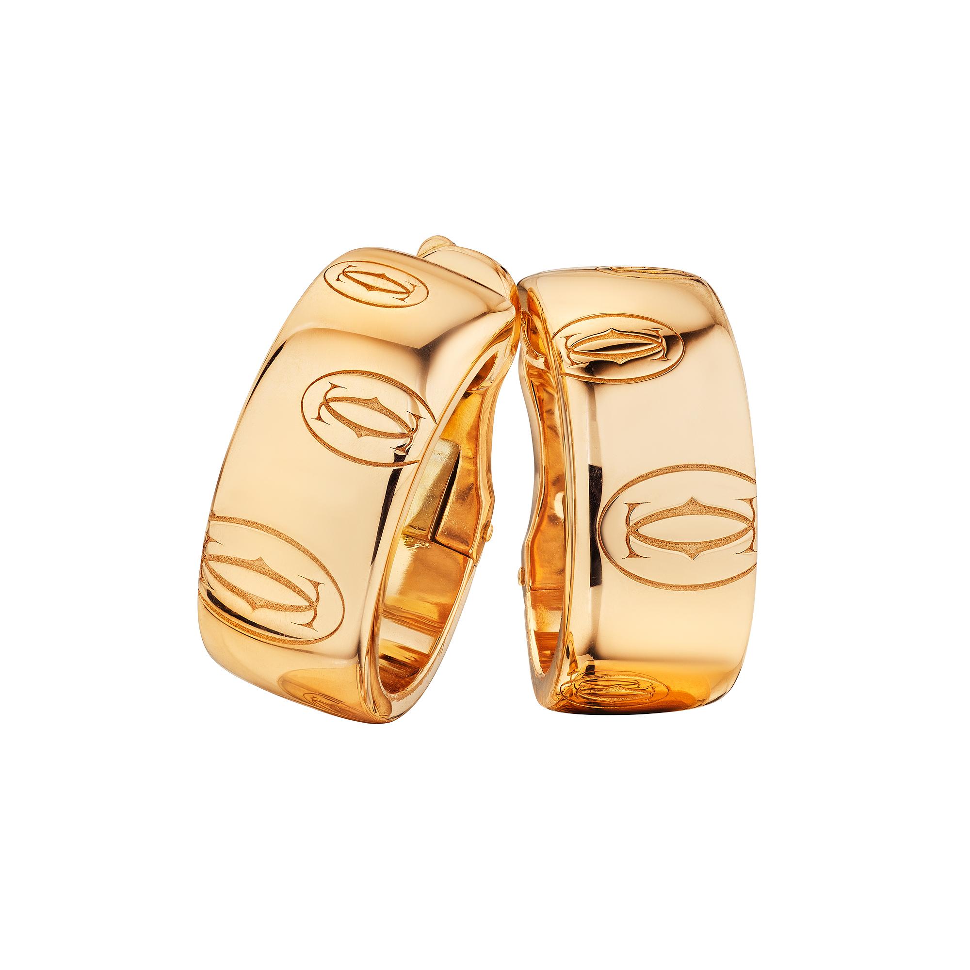 Subtly engraved with the iconic Cartier logo, these vintage Cartier rose 18 karat rose gold post back hoops are as collectible as they are wearable.  Signed Cartier with serial number FC9723.  Circa 2000-2010.  3/4