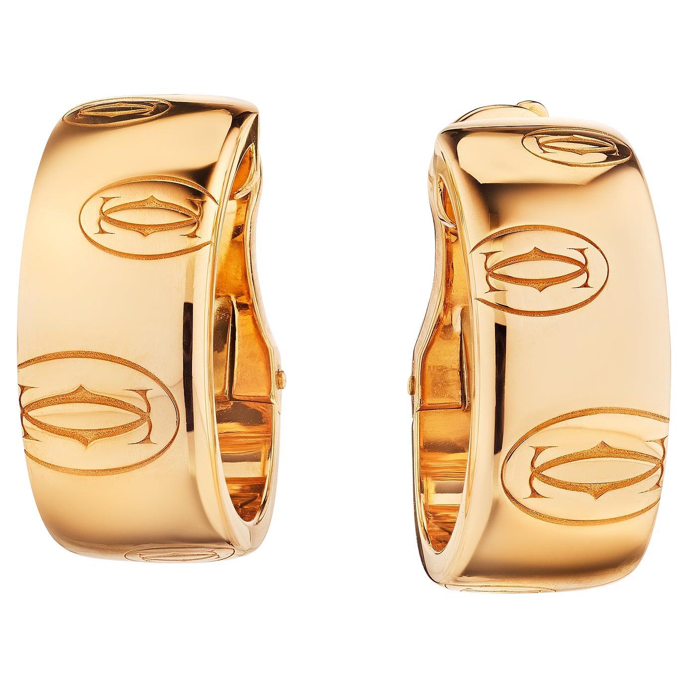 Cartier Créoles modernistes en or rose avec logo