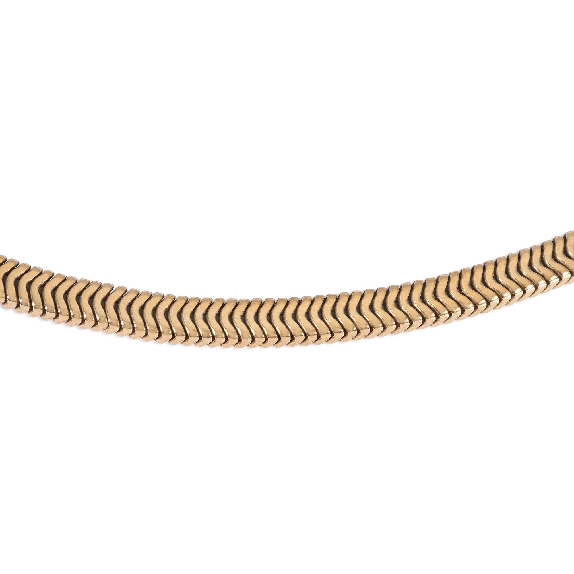 A Retro gold collar-length necklace of boxed snake chain design, completed by an incised barrel-form clasp, in 18k.  Cartier, London. #H7141.
Elegant simplicity that works just as well on its own or layered with complementary looks.

* Includes