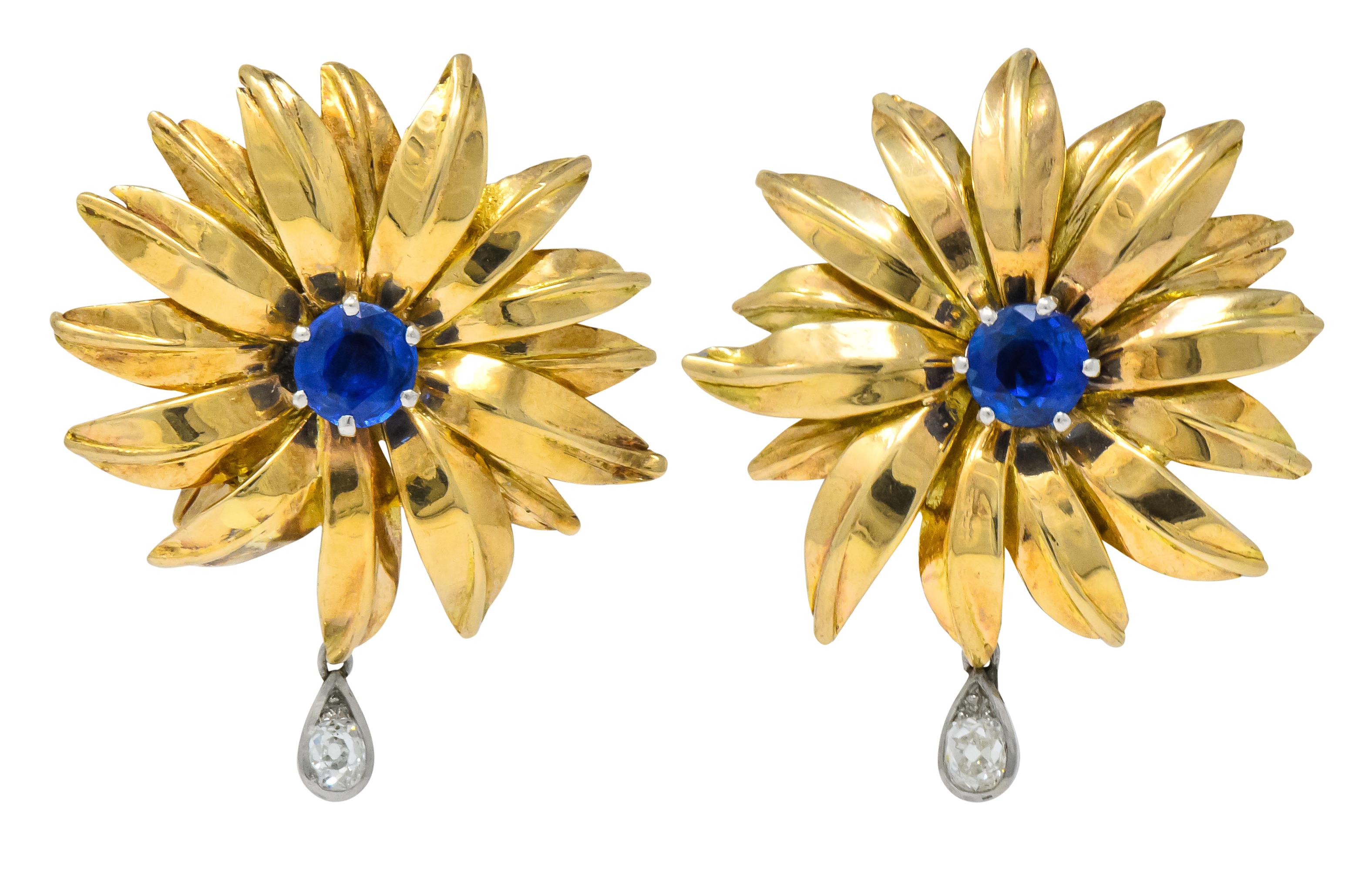 Stunning Cartier Unheated Burmese Sapphire and Diamond Earrings

Circa 1940 London

Lovely 18K yellow gold flower design featuring Burma sapphires and old mine cut diamond dangles 

Royal blue round sapphires weighing approximately 1.80