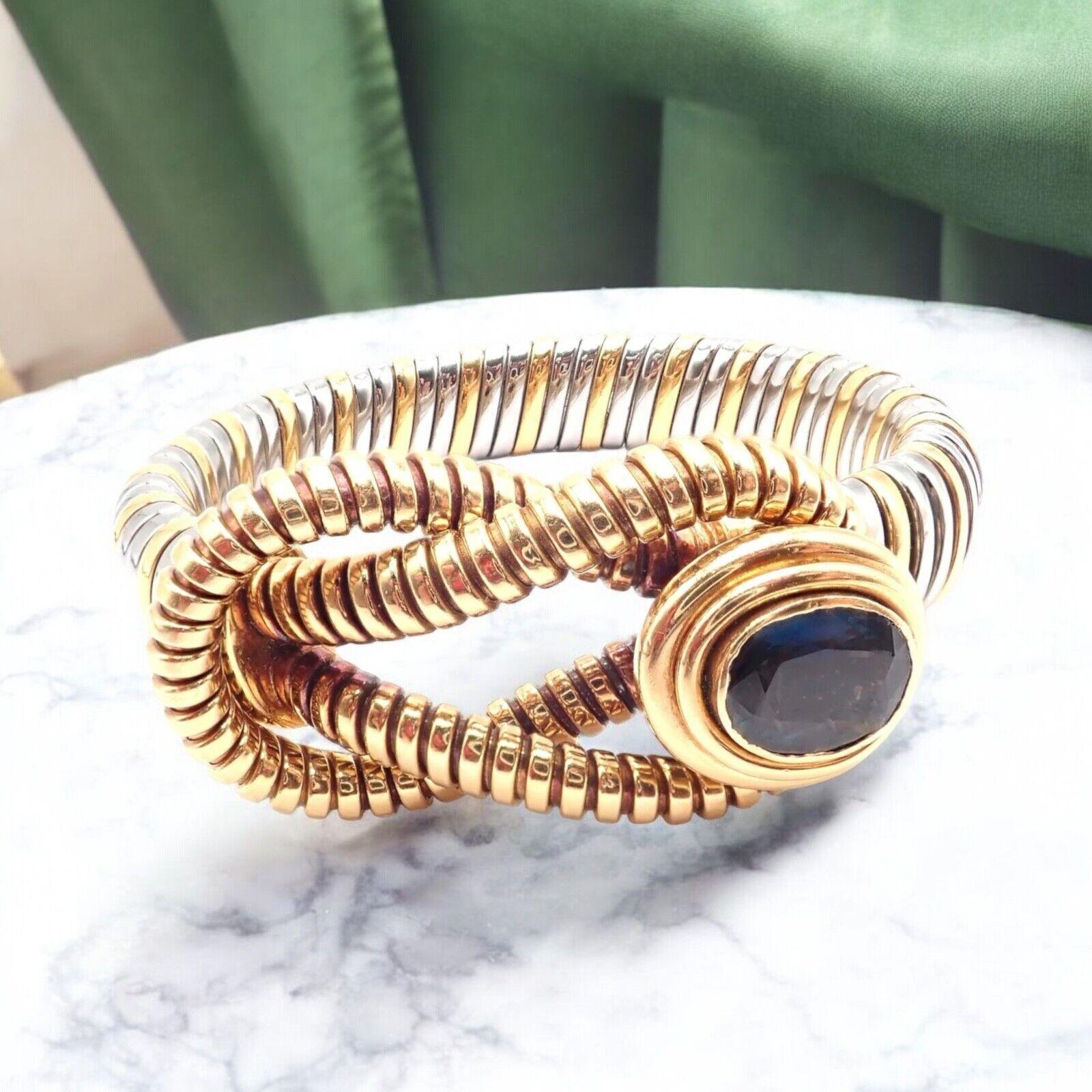 18k Yellow Gold And Stainless Steel London Blue Topaz Hercules Knot Bracelet by Cartier.  
The Cartier Hercules Knot bracelet is crafted from 18k yellow gold and steel, featuring a striking London blue topaz. 
This elegant piece showcases Cartier's