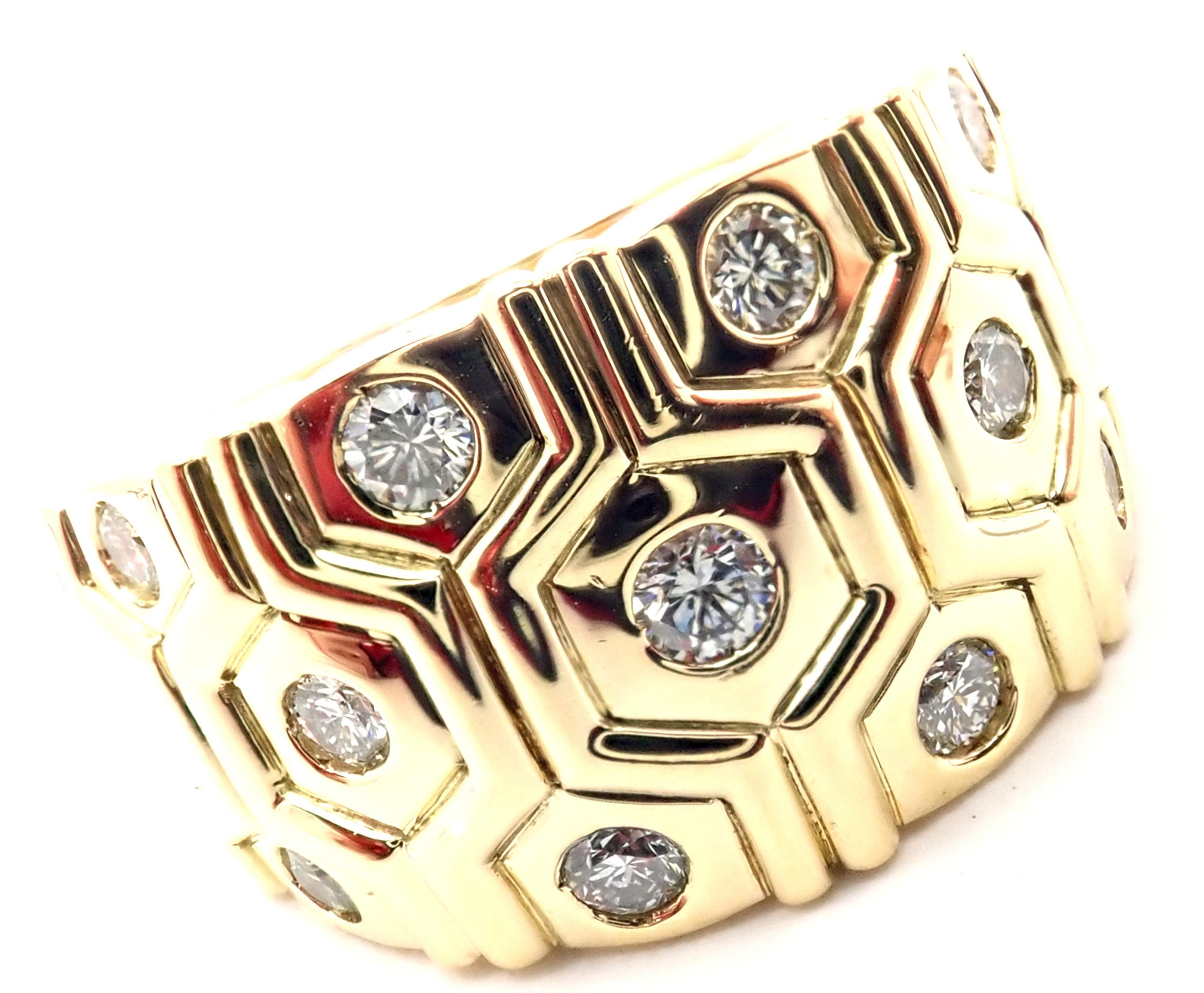 18k Yellow Gold Diamond Wide Beehive Band Ring by Cartier London.
With 11 round brilliant cut diamonds VVS1 clarity, E color total weight approximately .50ct
This ring comes with Cartier box and a Cartier certificate from 1989.
Details: 
Size: