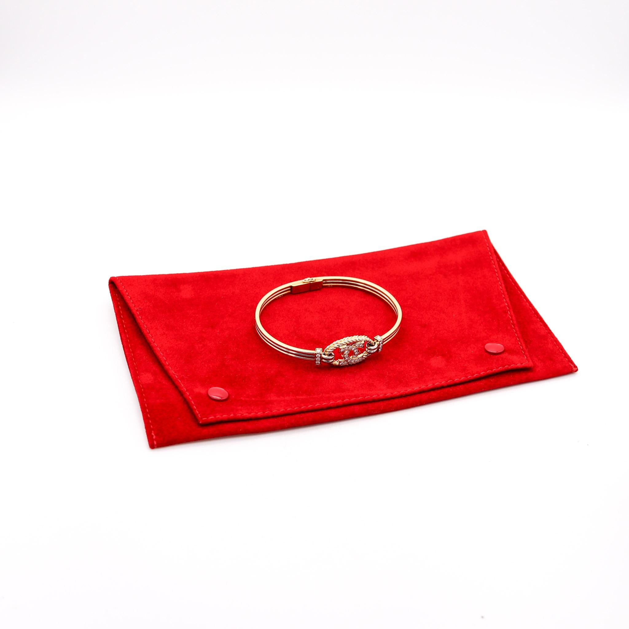 Bangle Bracelet designed by Cartier London.

A rare three color trinity bangle bracelet, created in London England by the jewelry house of Cartier, back in the 1987. This bracelet has been crafted in three colors of solid gold of 18 karats with high