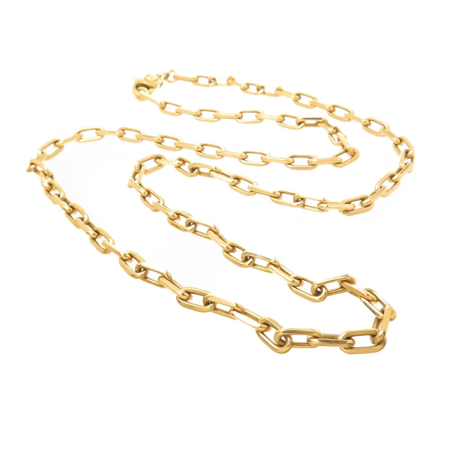 Circa 2000 Cartier 18K Yellow Gold Link Chain, measuring 20 inches in length, 1/8 inch wide and having Rectangular Links with a secure Lobster Claw lock. Signed and Numbered. 