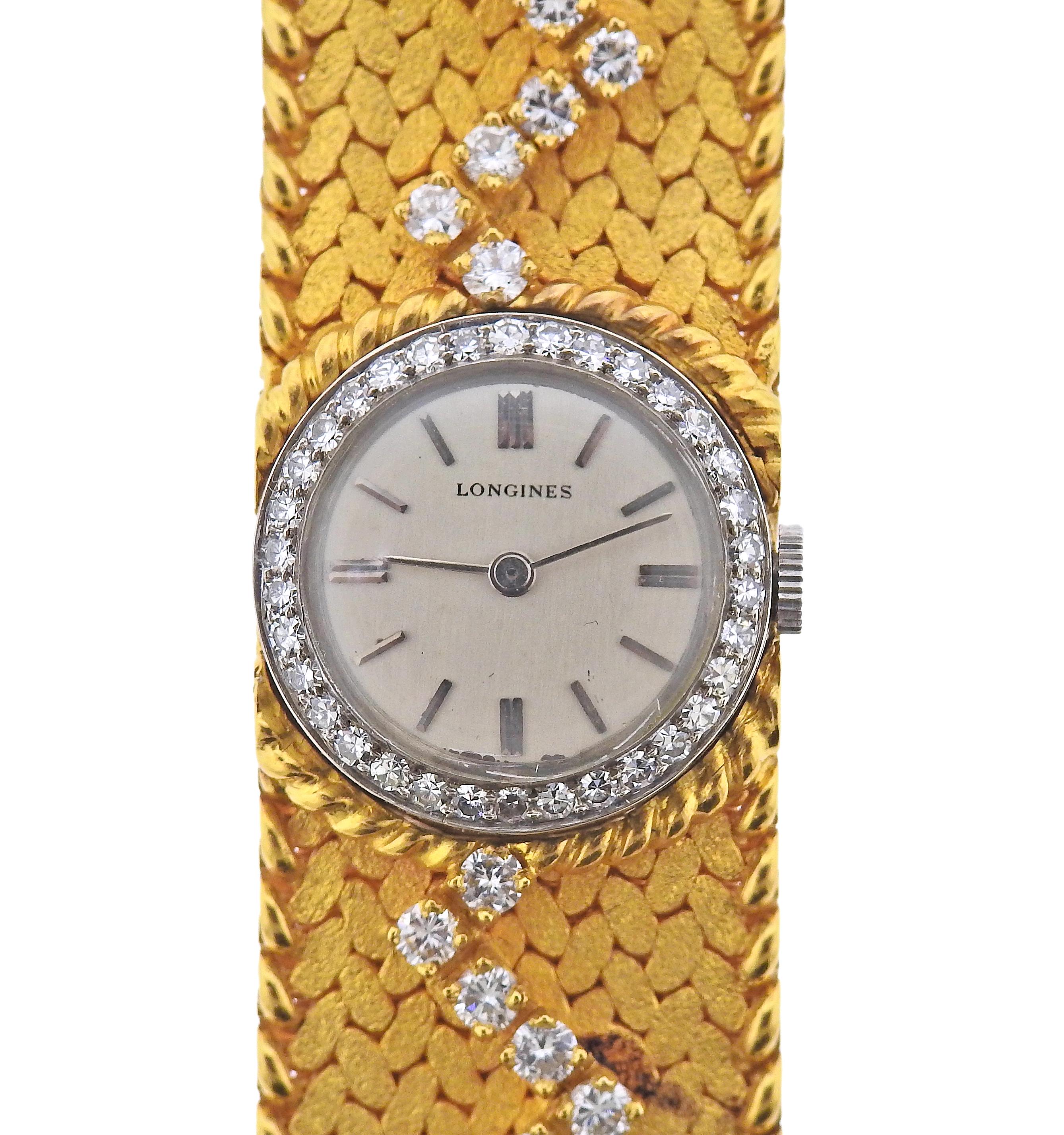18k gold bracelet by Cartier, adorned with approx. 3.65ctw in diamonds, featuring Longines manual wind watch. Bracelet is 7 2/8