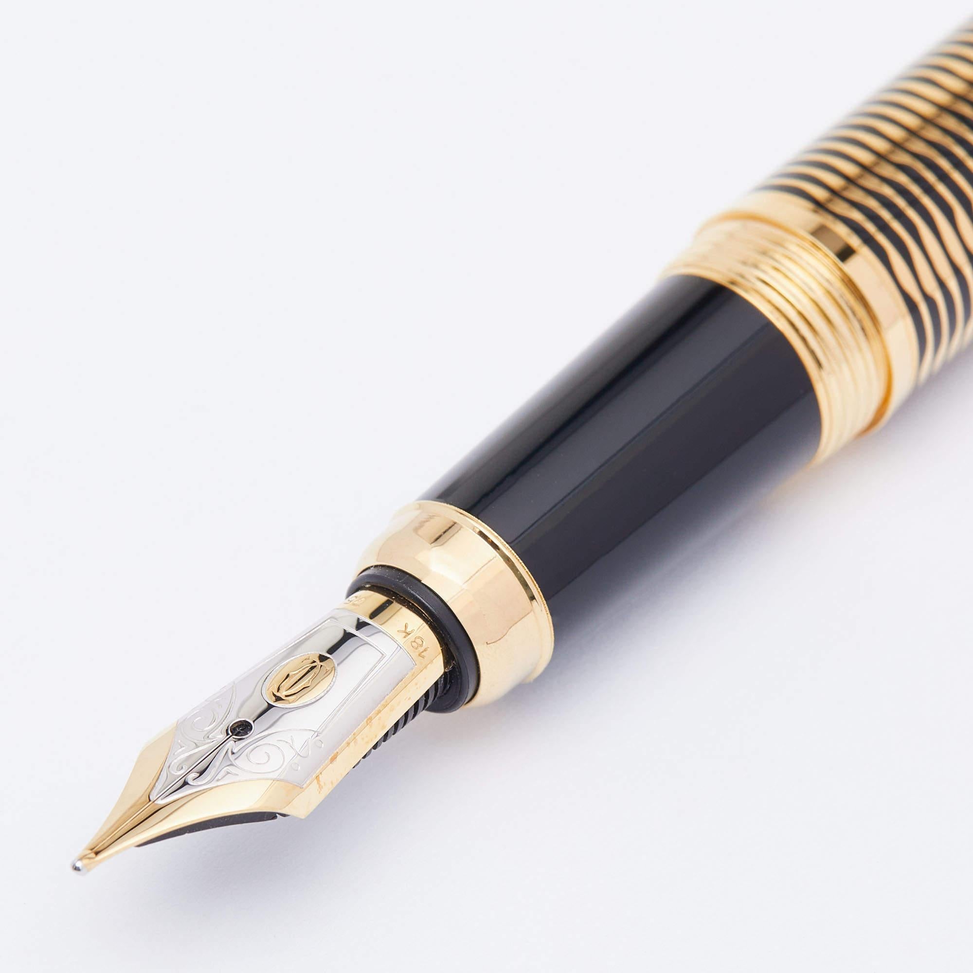 This Cartier fountain pen is from the Louis Cartier Limited Series and it is crafted from gold-plated metal. It has a pocket clip and signature engravings. The pen is a creation that defines quality craftsmanship and technical precision.

Includes: