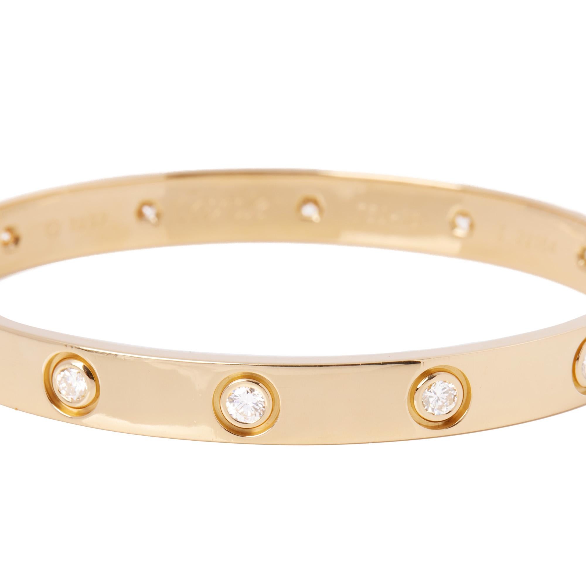 This bangle by Cartier is from their Love Collection and features the iconic screw details with the original style screw fastening and set with 10 round brilliant cut diamonds. Accompanied by a Cartier Pouch, this bangle has recently been serviced