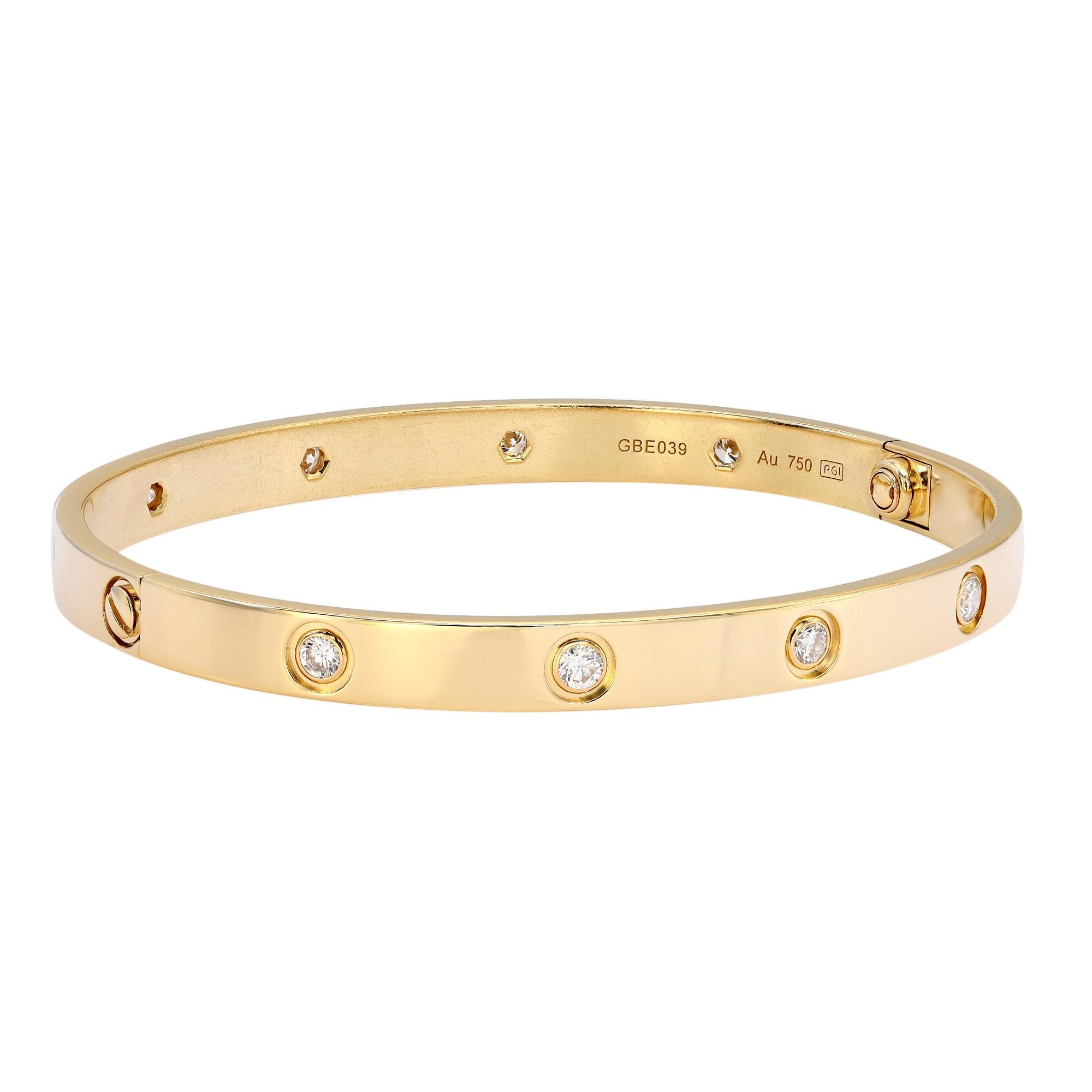 Cartier Love bracelet crafted in 18k yellow gold, set with 10 brilliant-cut diamonds totaling 0.96 carat. New screw system. Comes with a screwdriver. Width: 6.1 mm. Total weight: 32.65 grams. Excellent pre-owned condition. Will be polished before