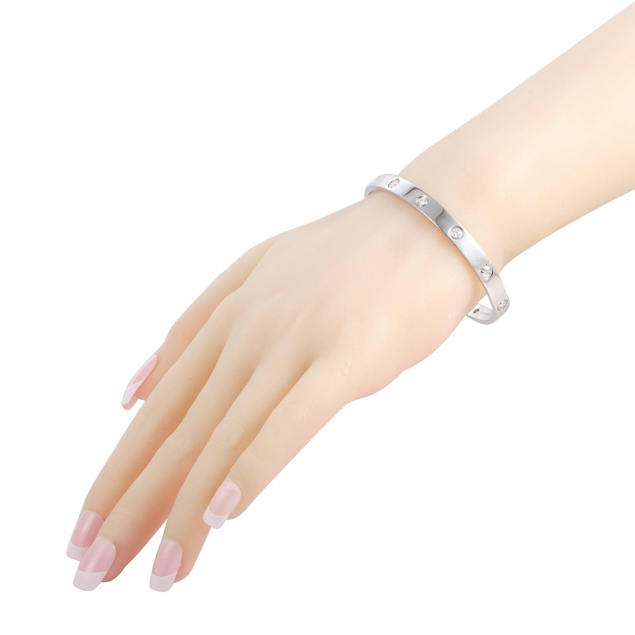 A piece from the acclaimed “LOVE” collection by Cartier, this sublime bracelet offers a splendidly elegant look. The bracelet is made of 18K white gold and it is set with 10 diamonds that amount to 0.96 carats. This bracelet comes with a matching