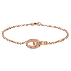 Bracelet Cartier Love en or rose 18 carats sur chaîne, signé et numéroté