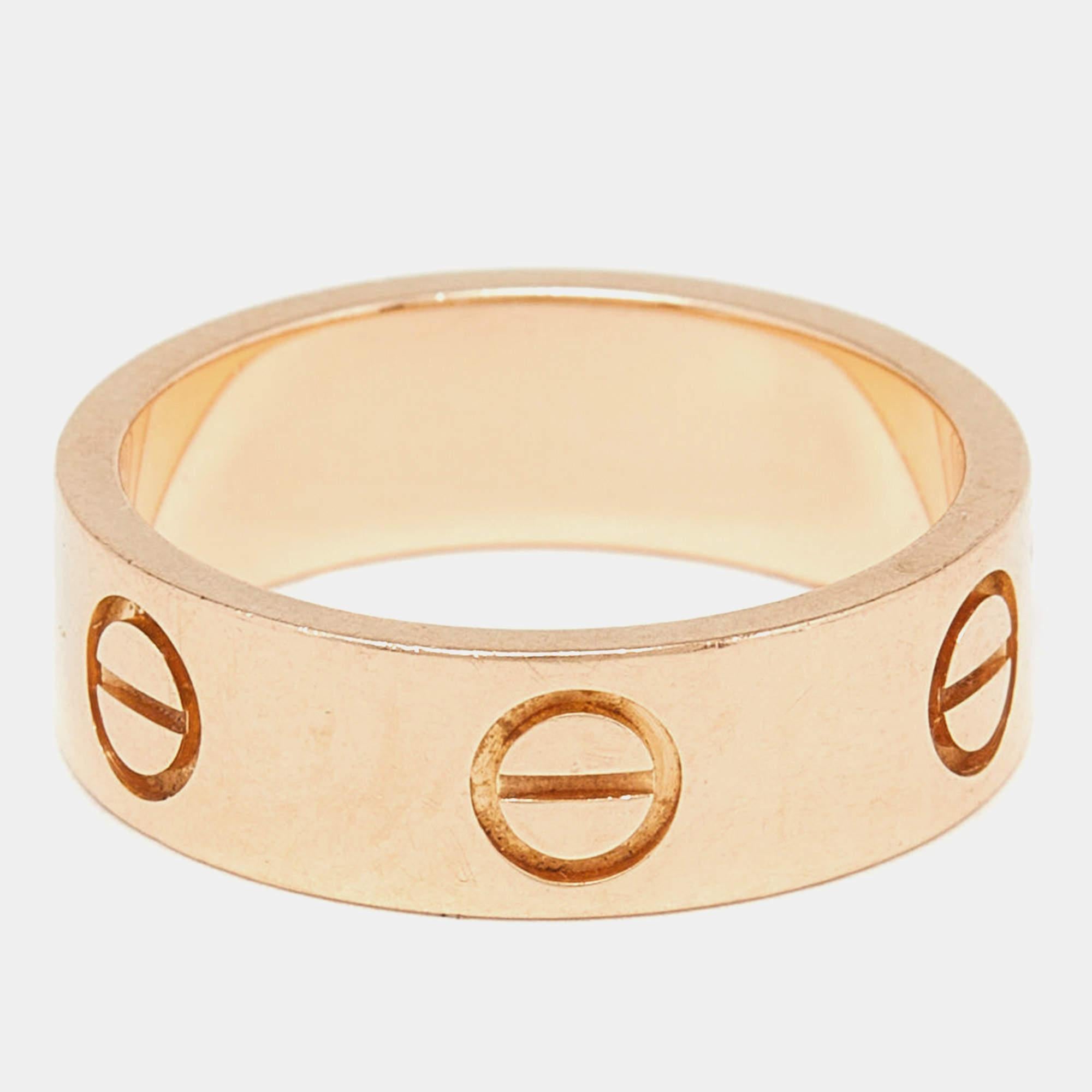 Experience the epitome of luxury and craftsmanship with this authentic Cartier Love ring in 18k yellow gold. Its timeless elegance and exceptional detailing make it a statement piece for any occasion.

Includes: Original Box

