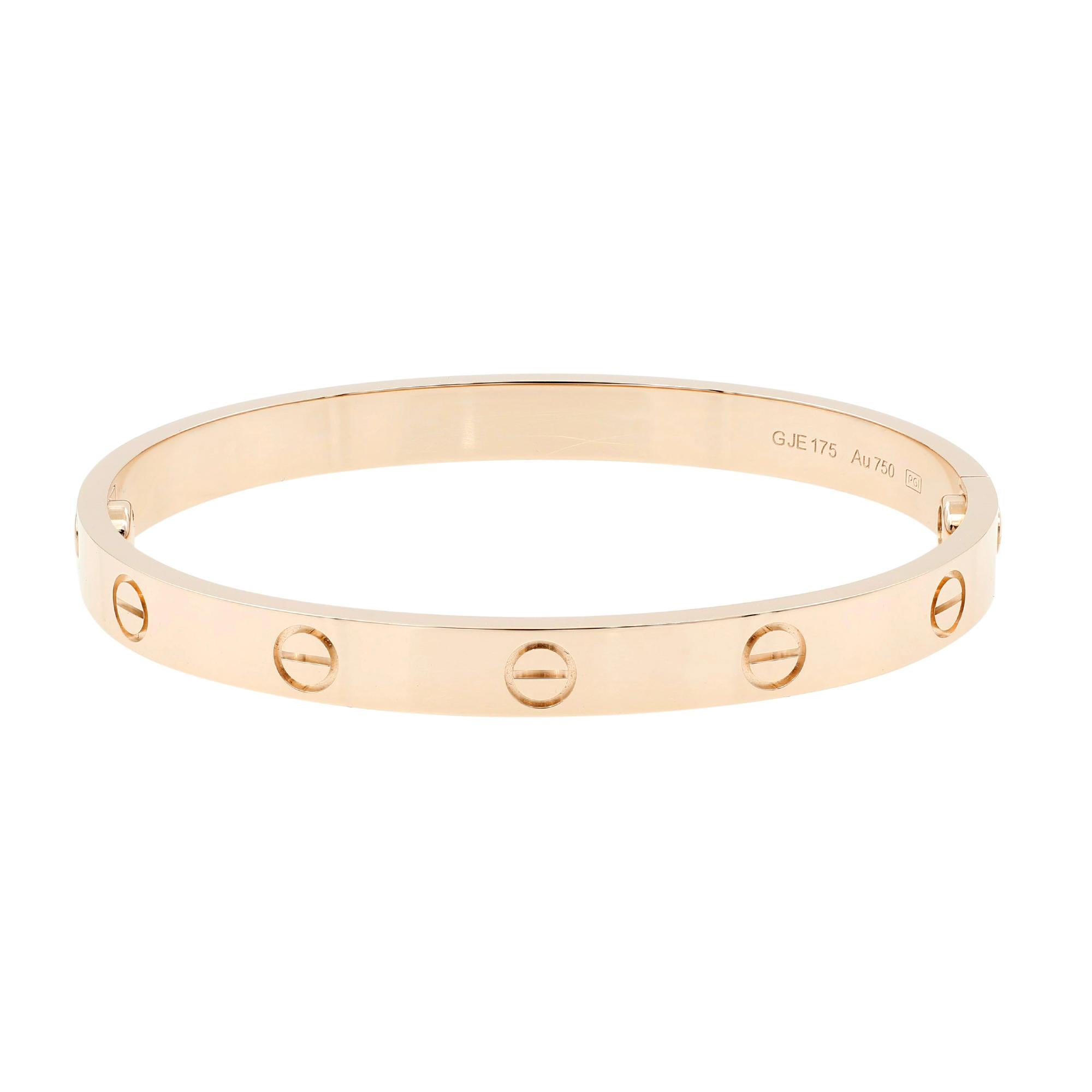 You are viewing a stunning Cartier 18 karat rose gold love bracelet. This 18K rose gold bracelet features the signature Cartier design and comes stamped with serial numbers, and other hallmarks, along with its original box, papers, screwdriver. Size