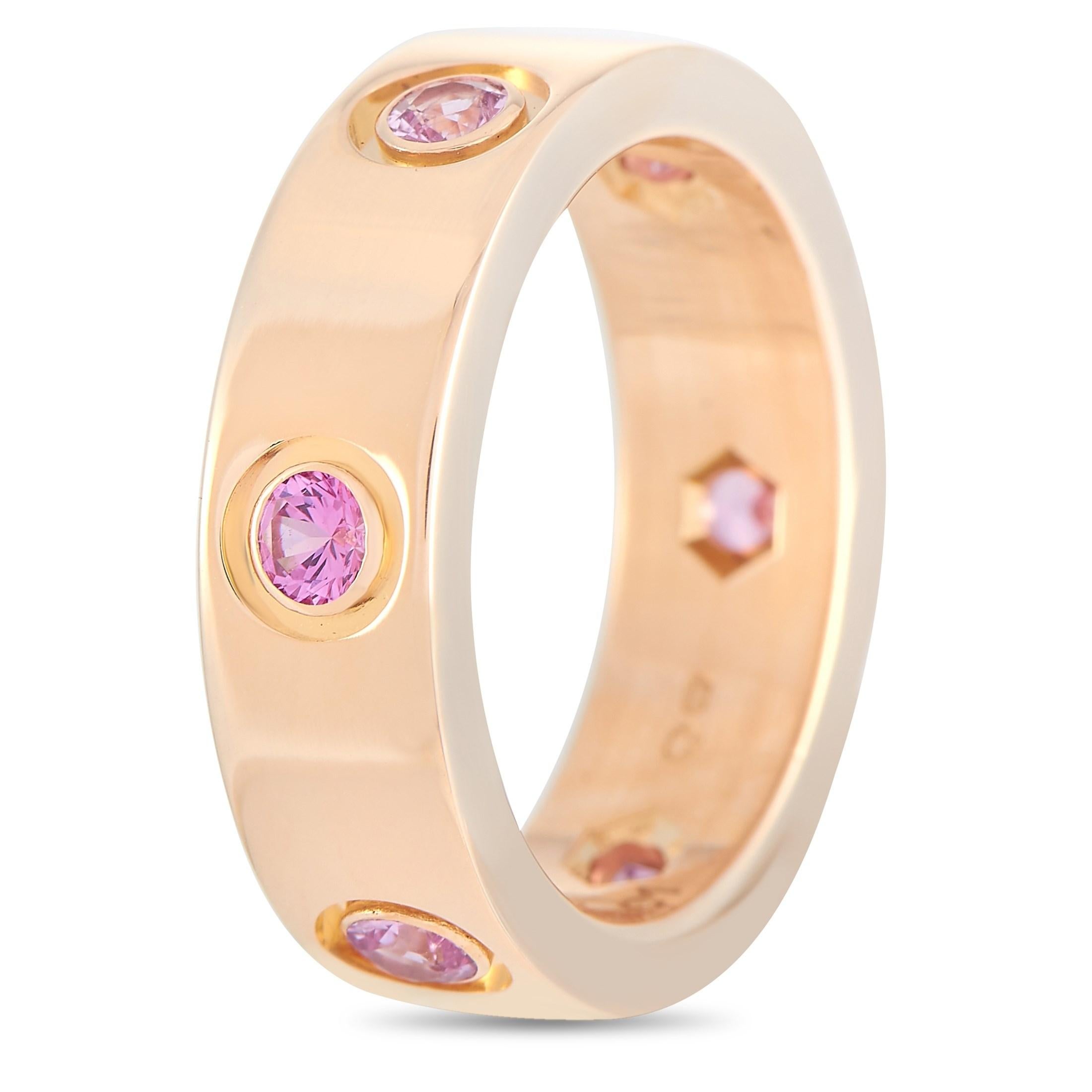 This Cartier Love 18K Rose Gold Pink Sapphire Band Ring is oozing with the signature Cartier style. The band is made with lovely 18K rose gold and set with six round-cut pink sapphires evenly spaced around the ring. The inside of the band is