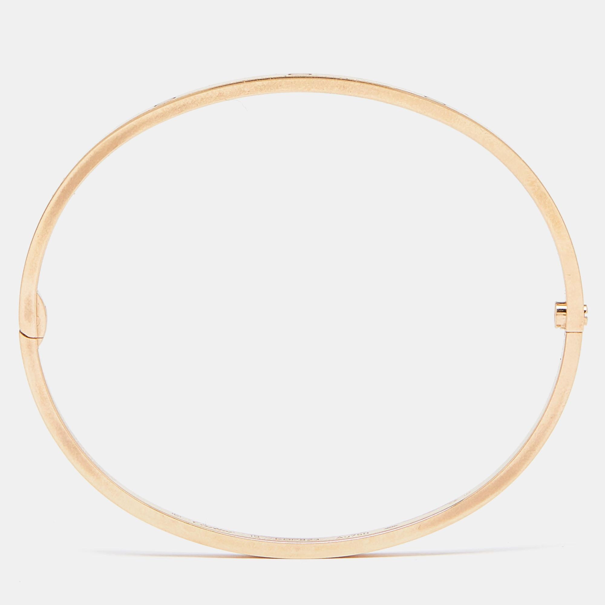 The Cartier Love bracelet is an exquisite masterpiece, seamlessly blending luxury and romance. Crafted in lustrous 18k rose gold, its iconic Love motif adds a touch of brilliance. The elegant design symbolizes eternal love and commitment, making it