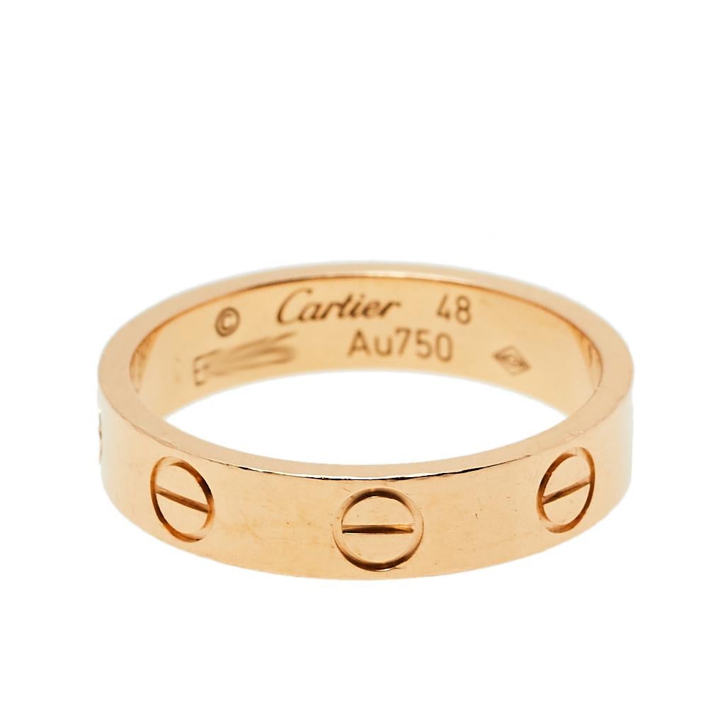 One of the most iconic designs from the house of Cartier, this stunning Love ring is a symbol of style and luxury. Constructed in 18K rose gold, this wedding ring has the signature screw details all around the surface. The ring is sure to become
