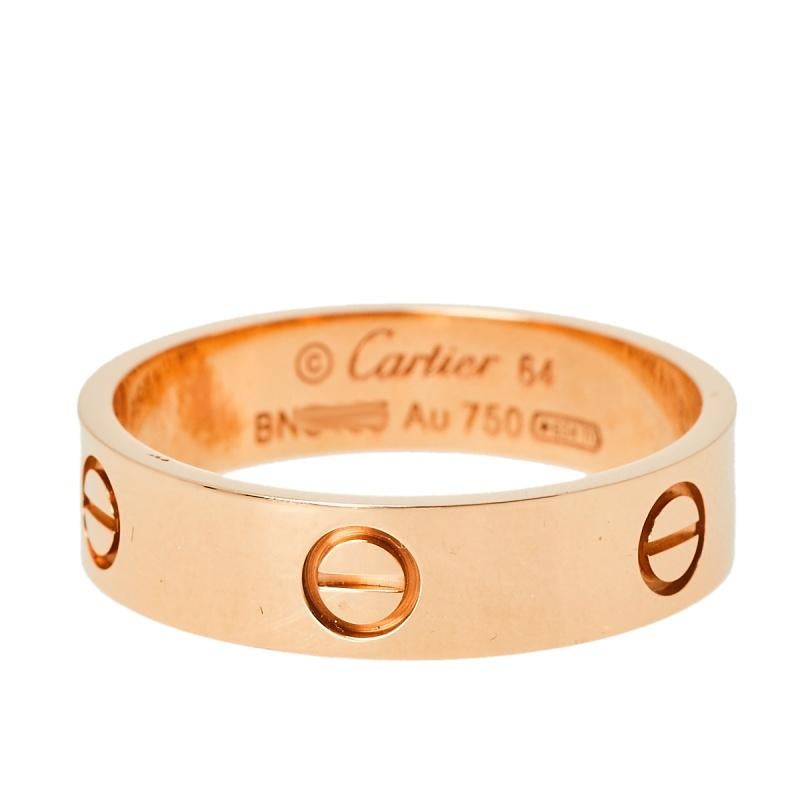 One of the most iconic and loved designs from the house of Cartier, this stunning Love ring is an icon of style and luxury. Constructed in 18k yellow gold, this ring features screw details all around the surface as symbols of a sealed and secured