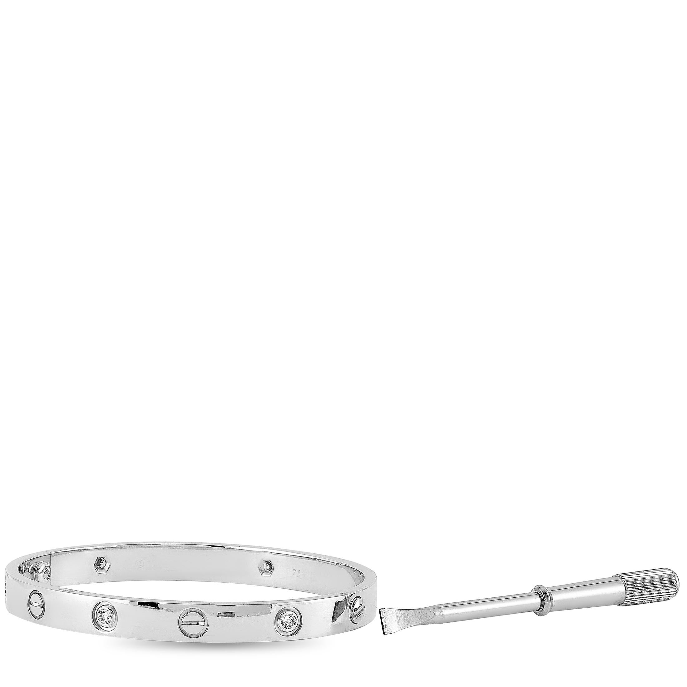 The Cartier “LOVE” bracelet is crafted from 18K white gold and set with six diamond stones that amount to 0.60 carats. The bracelet weighs 32.3 grams, measures 6.65” in length, and is delivered with a screwdriver.

This jewelry piece is offered in