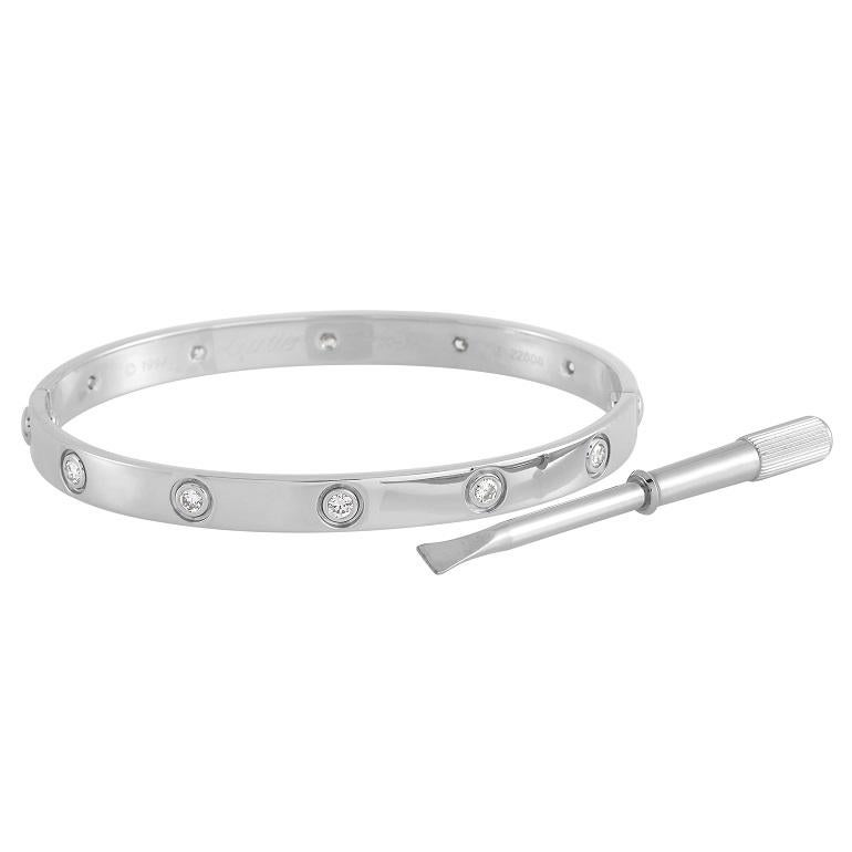 This bracelet from the Cartier Love collection is an iconic piece that exudes the brand’s signature sense of luxury. Crafted from 18K White Gold, its beautifully accented by 10 glittering round-cut diamonds. This size 19 design measures 7.5” long
