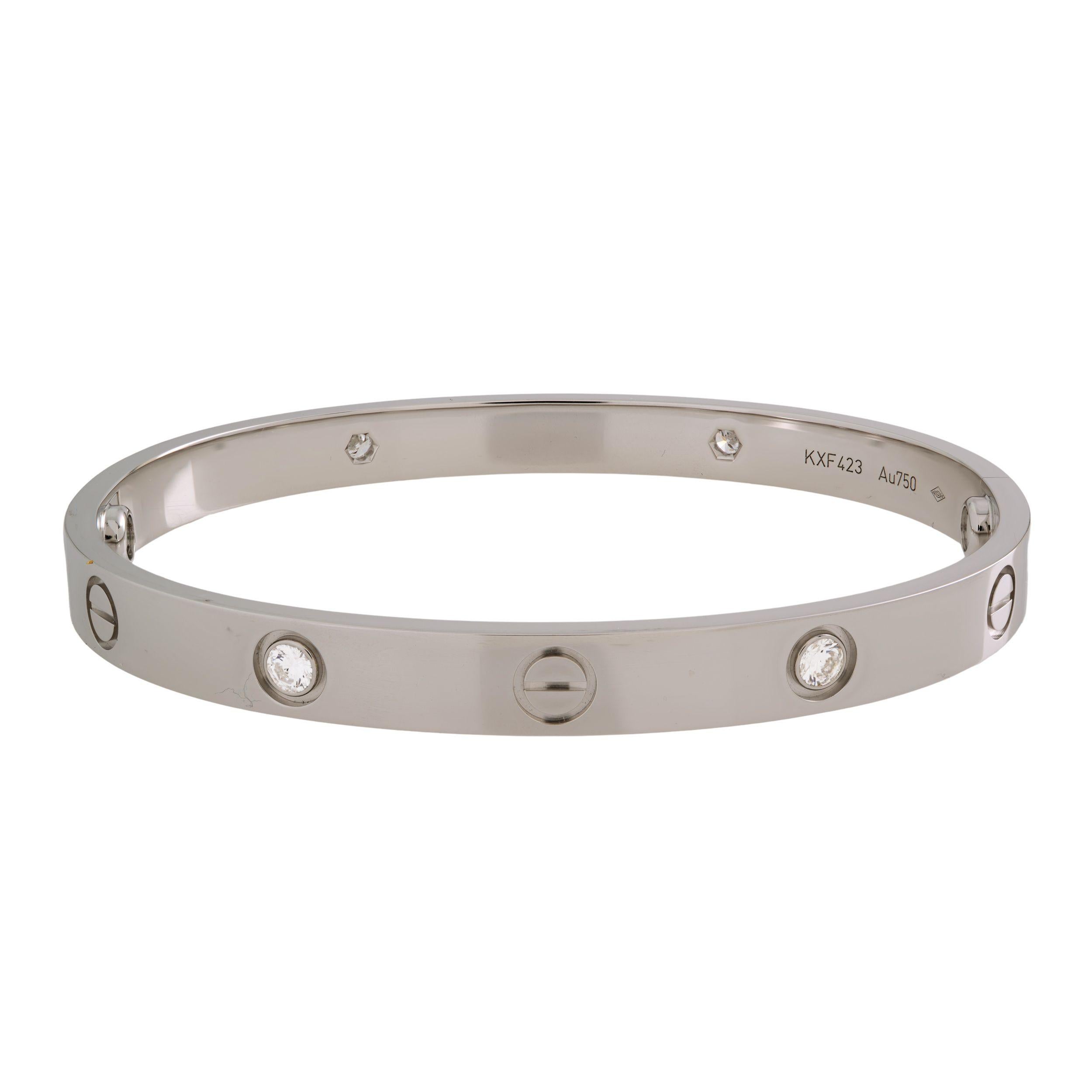 The famous Cartier Love bracelet, 18K white gold, set with 4 brilliant-cut diamonds totaling 0.42 carats. Size 18. Width: 6.1mm. unworn condition. No signs of wear. Comes with original box , papers and a screw driver. 