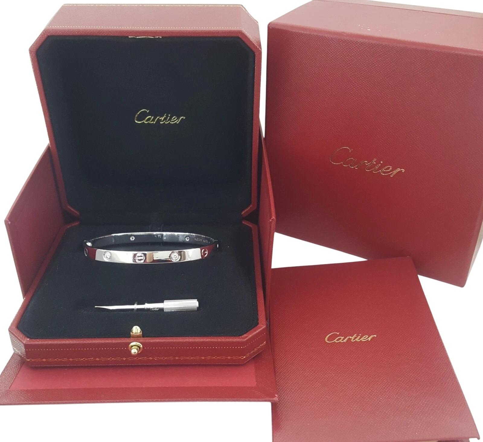 Iconic and timeless, this authentic Cartier LOVE bracelet is crafted from solid 18K white gold and features four round brilliant cut diamonds totaling approximately 0.42 carats. The diamonds are graded F+ in color and VS+ in clarity, each measuring