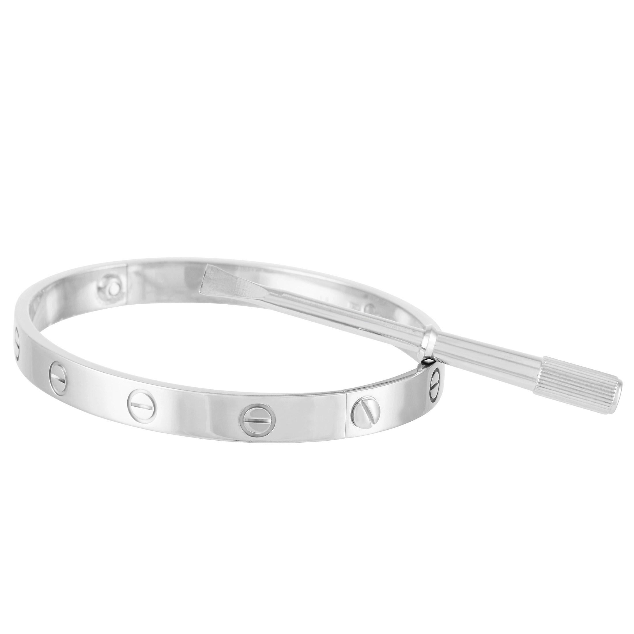 This Cartier Love 18K White Gold Bangle Bracelet is a classic Cartier piece, the bangle measures 7.1 inches in diameter and is set with the signature Cartier de Santos screws throughout. The bangle weighs a total of 35.4 grams. 

This bracelet is
