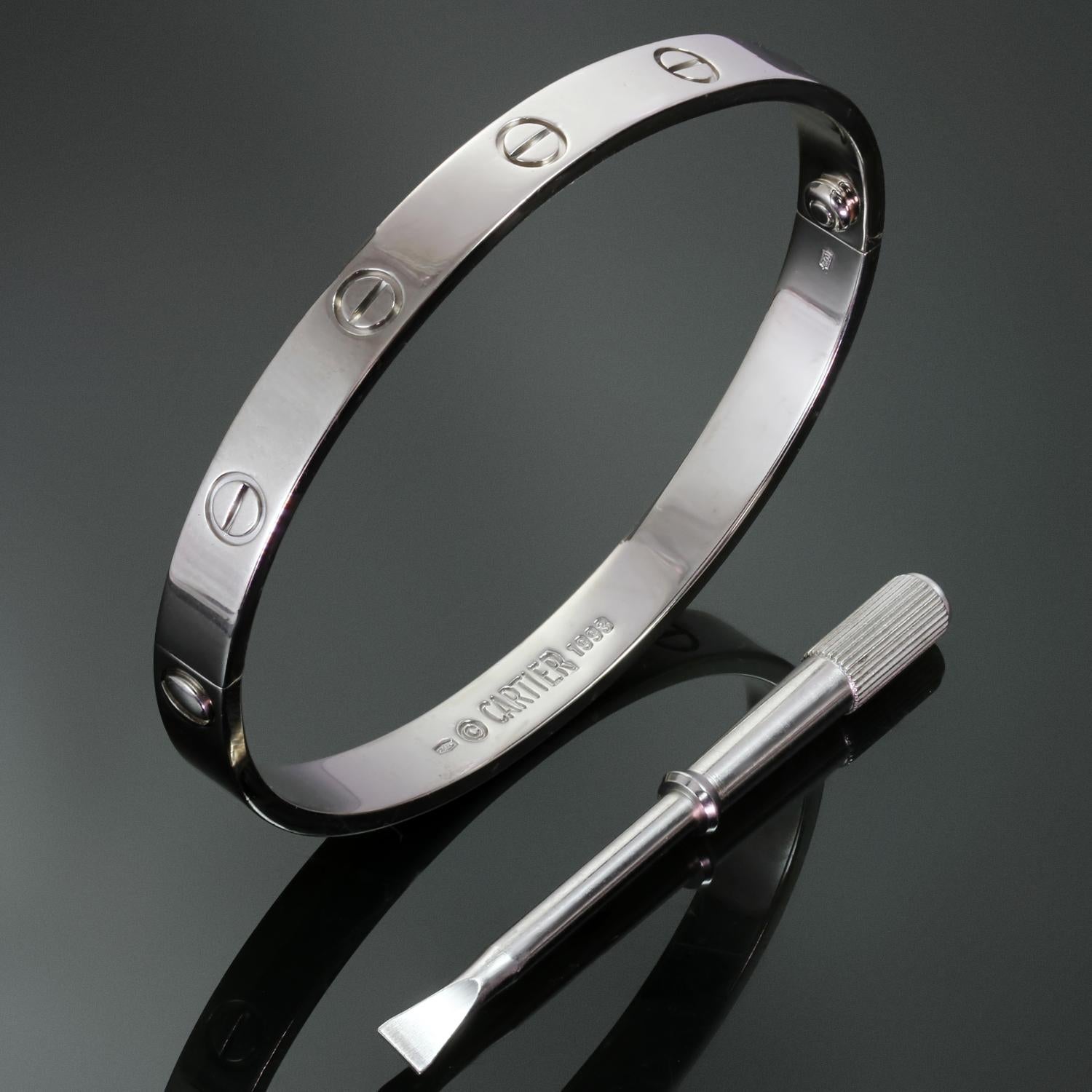This classic authentic Cartier bangle from the iconic Love collection is crafted in 18k white gold and completed with the original screwdriver. This bracelet is a size 18. Made in France circa 1993.  Measurements: 0.23