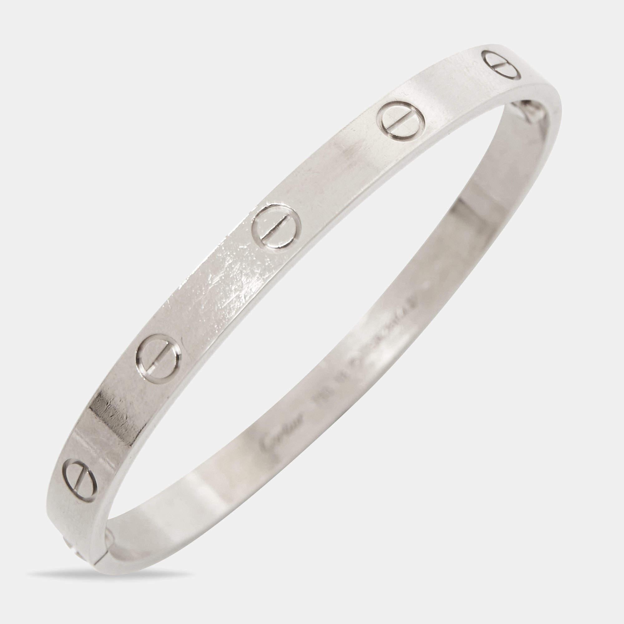 Cartier's Love bracelet is a modern symbol of luxury and a way to lock in one's love. Designed in an oval shape to comfortably sit around your wrist, the iconic love handcuff is laid with distinct screw motifs and secured by screw closure. This