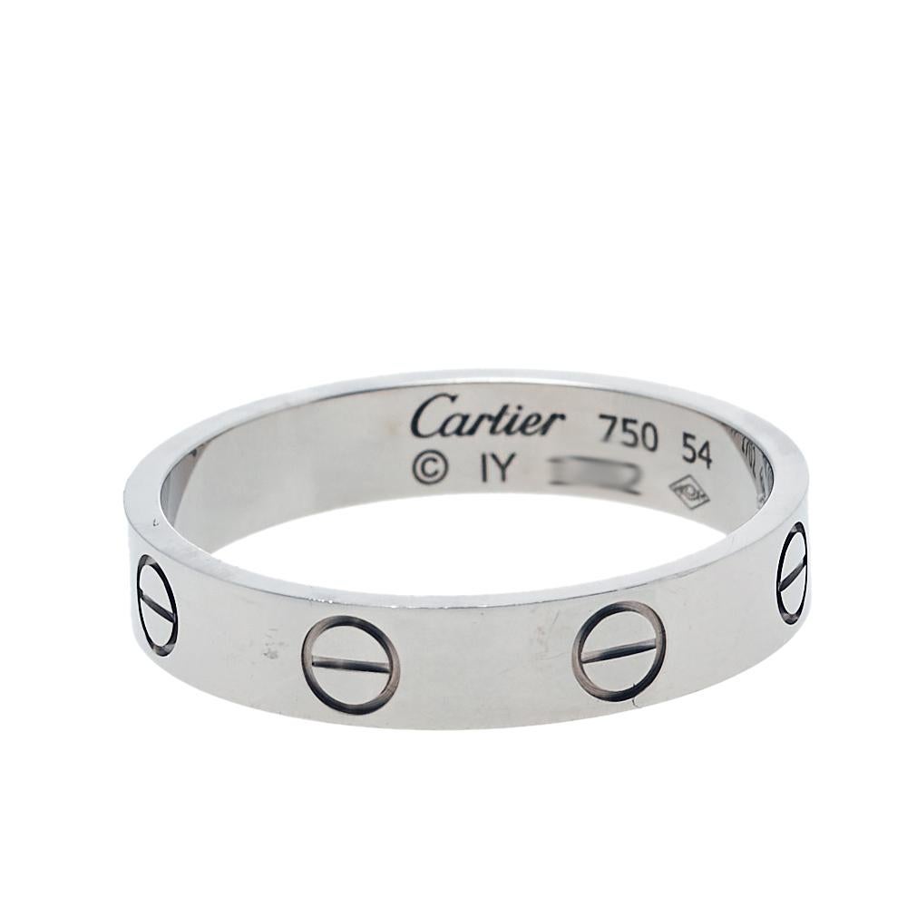 Cartier's Love band continues to be a favored choice when it comes to choosing a wedding or engagement ring. Highlighted by screw motifs, the original Love icon from the 1970s heralds the idea of timeless romance. This ring here in size 54 is