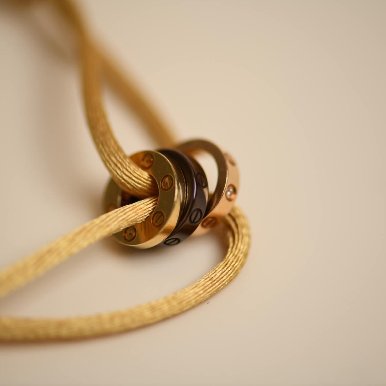 Cartier Love 18k Yellow and Rose 4 Diamond Sevres Porcelain Cord Bracelet In Excellent Condition In Banbury, GB