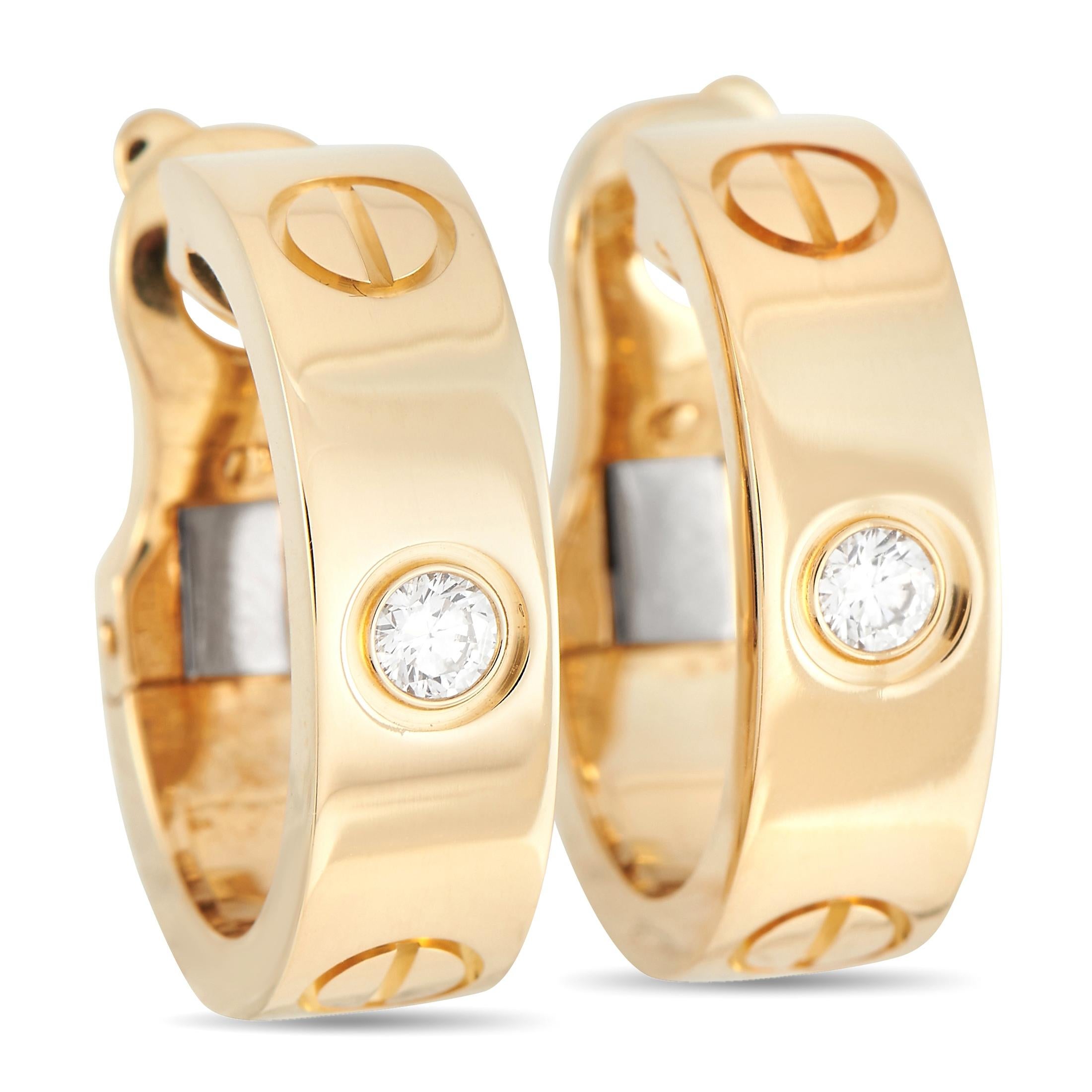 Elevate your jewelry collection with these iconic Cartier LOVE collection earrings. Each one is made from lustrous 18K Yellow Gold and includes a singular round-cut diamond at the center. They also boast a hoop-style design that measures 0.75” long