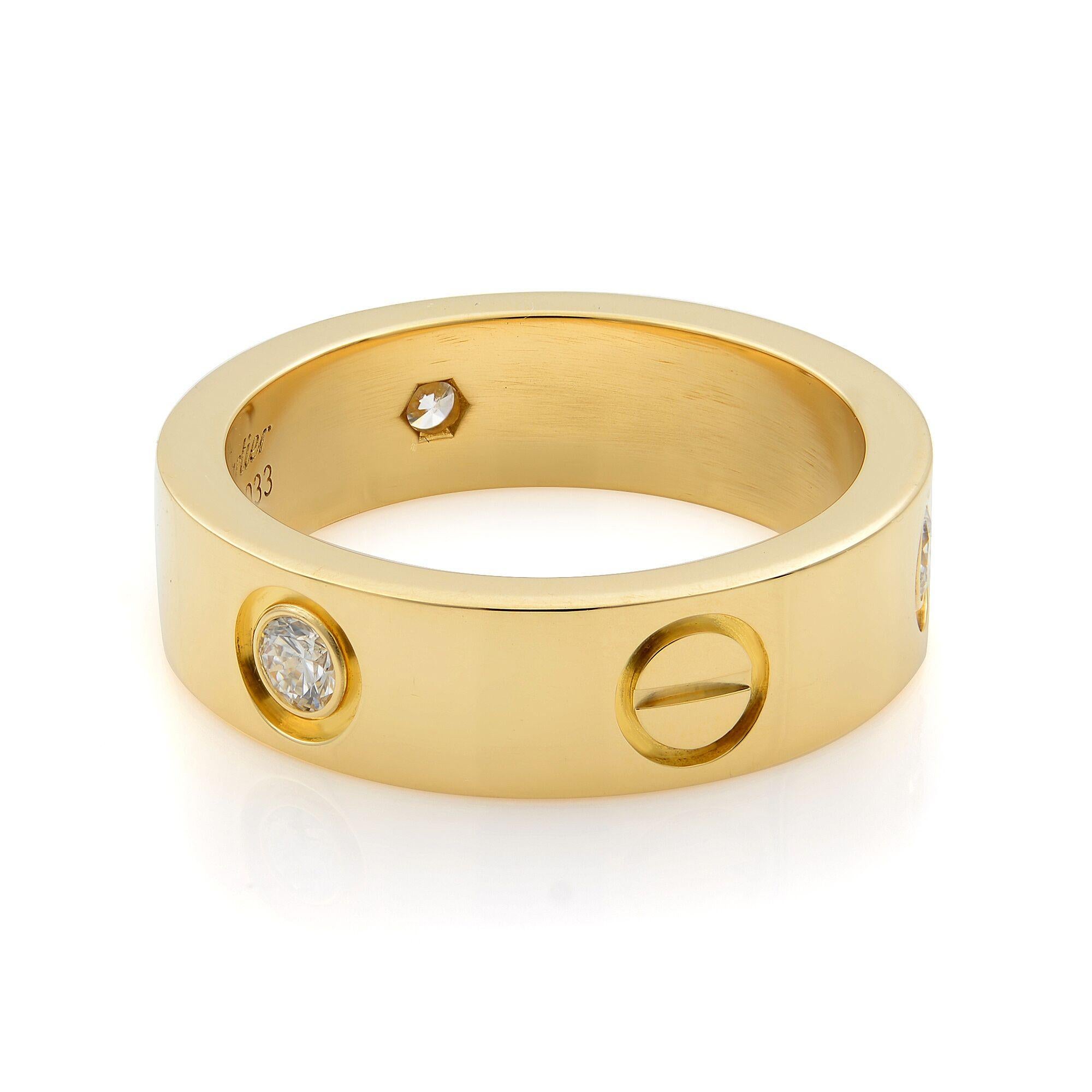 Cartier Love ring in 18K yellow gold, set with 3 brilliant-cut diamonds totaling 0.22 carats. Width of the ring is 5.5mm.
Excellent pre-owned condition (no signs of wear). Comes without original box and without papers. 