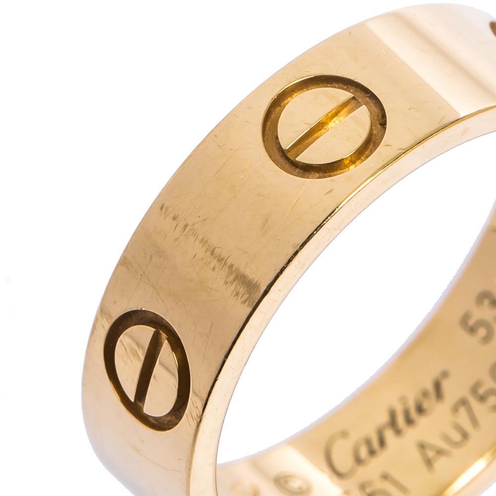 One of the most iconic and loved designs from the house of Cartier, this stunning LOVE ring is an icon of style and luxury. Constructed in 18k yellow gold, this ring features screw details all around the surface as symbols of a sealed and secured