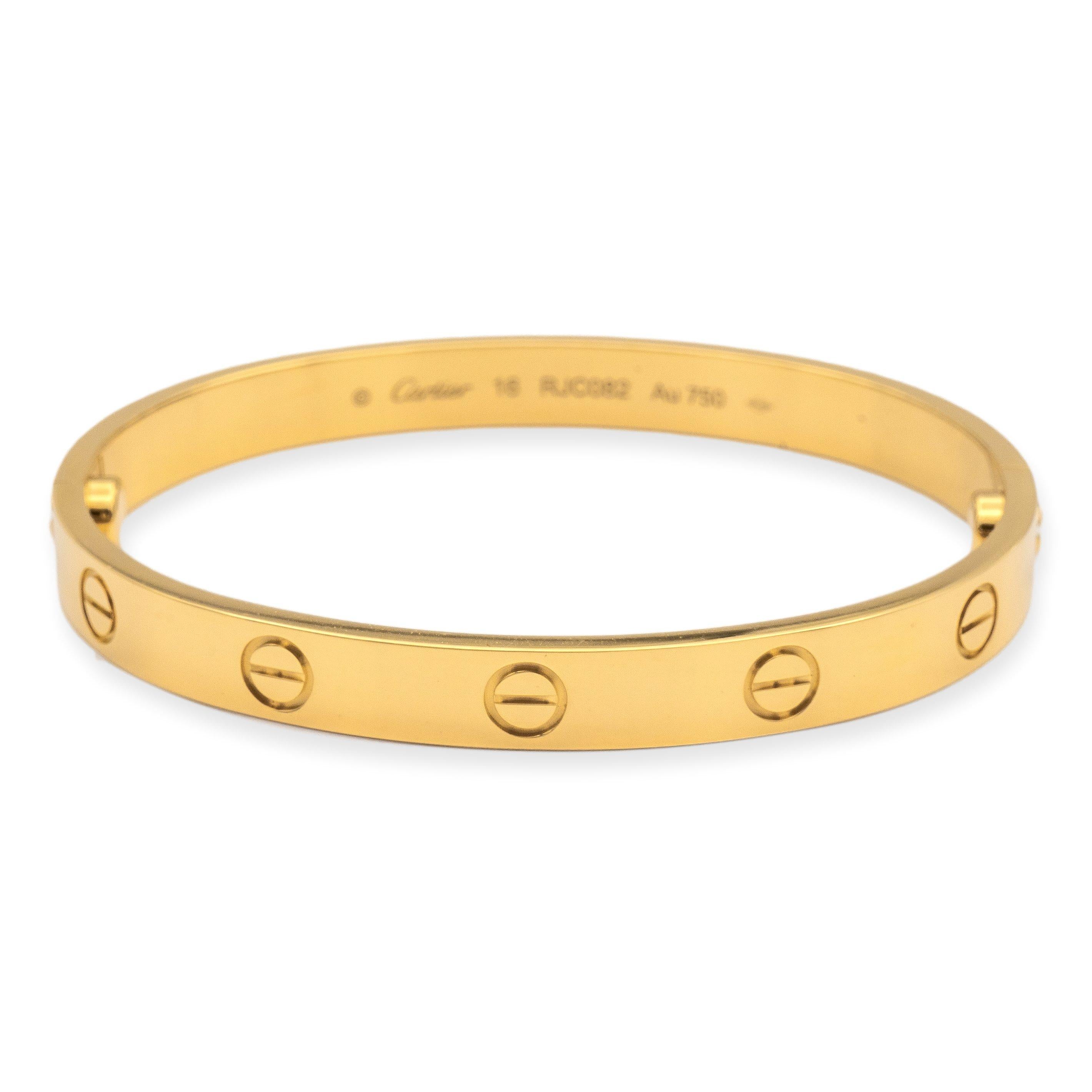 Cartier bangle bracelet from the iconic Love collection finely crafted in 18 karat yellow gold featuring screw motifs all the way around in a size 16. The closure is designed with two screws placed on either side of the bracelet.  Bracelet is fully