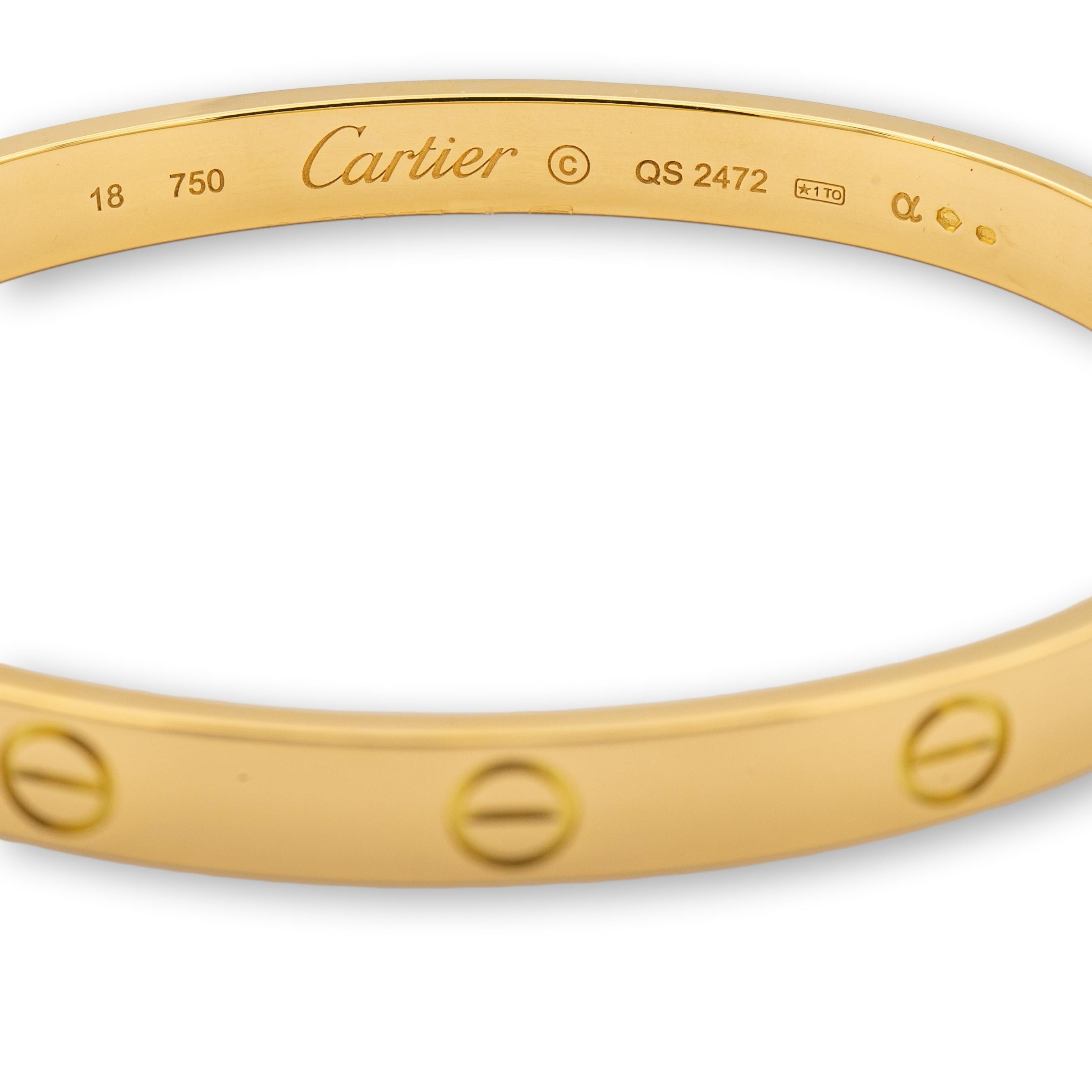 Cartier bangle bracelet from the iconic Love collection finely crafted in 18 karat yellow gold featuring screw motifs all the way around in a size 17. The closure is designed with two screws placed on either side of the bracelet.  Bracelet is fully