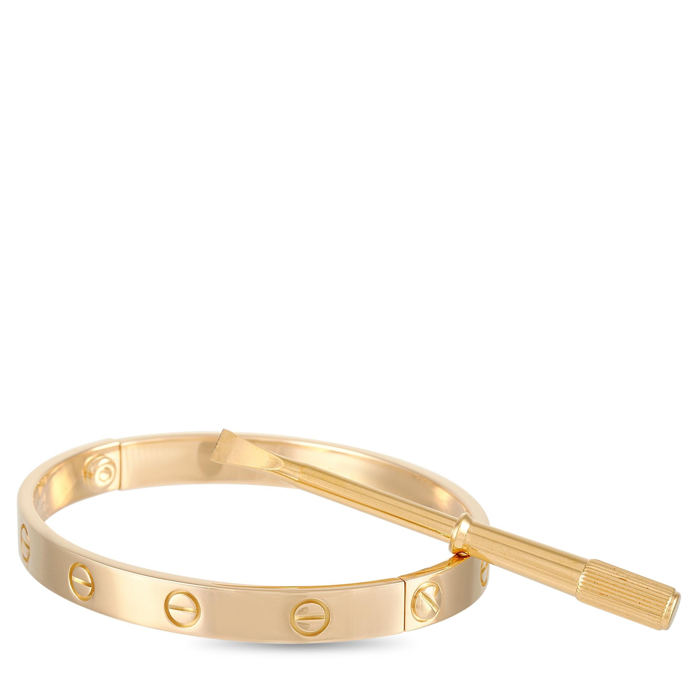 This Cartier Love 18K Yellow Gold Bangle Bracelet is a classic Cartier offering and includes a screwdriver. The simple bangle is made with 18K yellow gold and features the iconic Cartier screw motif. The inside of the bangle is inscribed with the