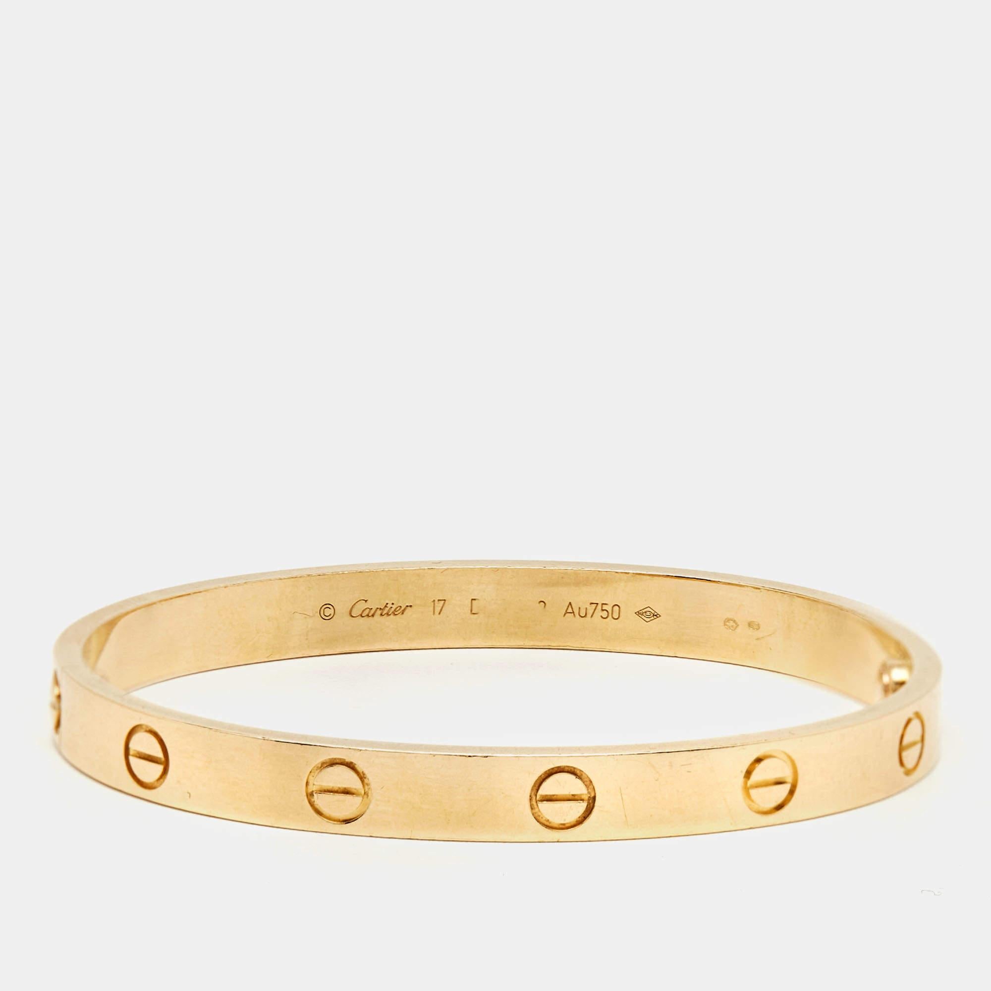 Crafted with exquisite finesse, the Cartier Love bracelet epitomizes timeless elegance. Its sleek design seamlessly blends luxury with simplicity, showcasing Cartier's renowned craftsmanship. The iconic screw motifs symbolize eternal love and