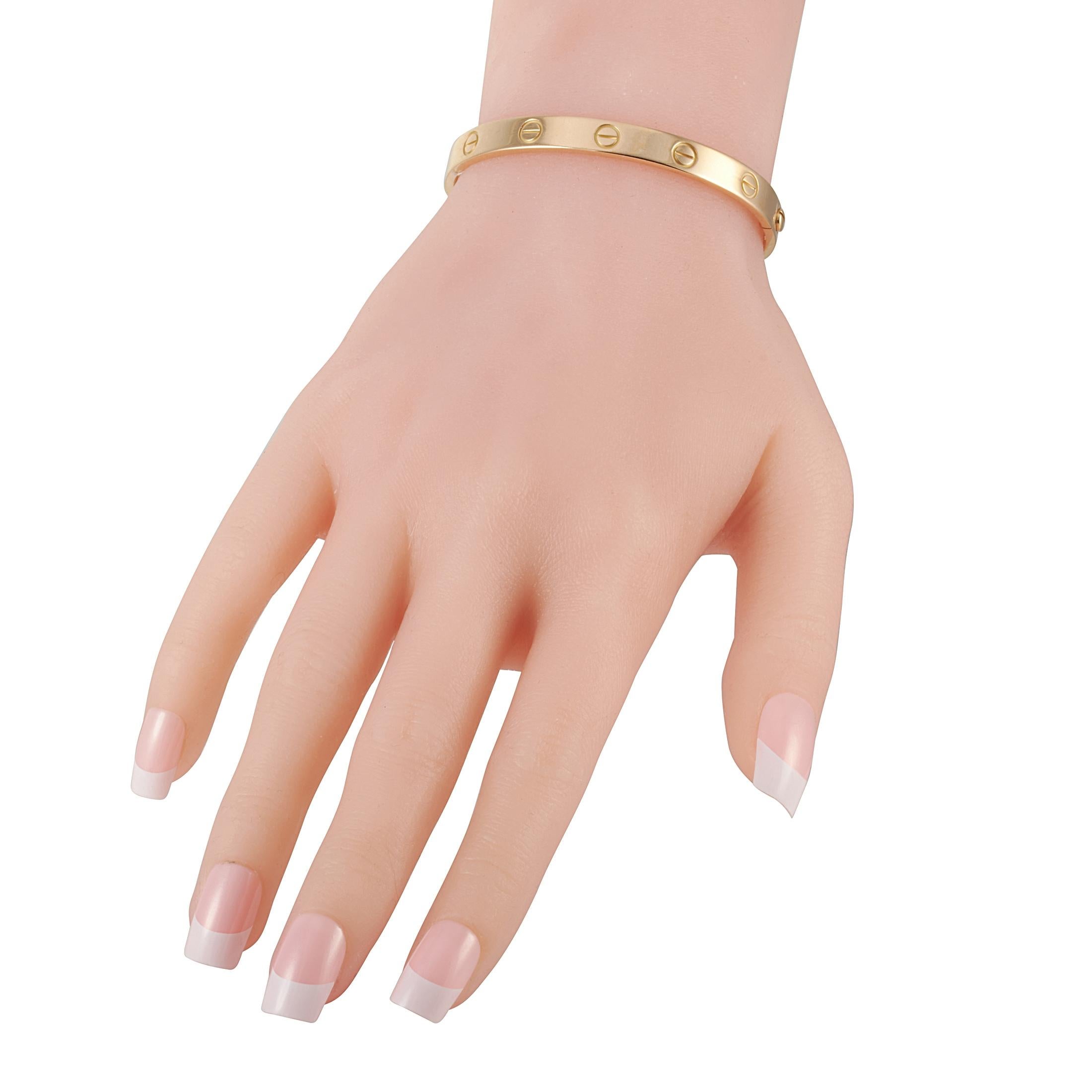 The Cartier “LOVE” bracelet is crafted from 18K yellow gold and measures 6.3” in length. The bracelet weighs 28.5 grams and is delivered with a screwdriver.

This jewelry piece is offered in estate condition and includes a gift box.