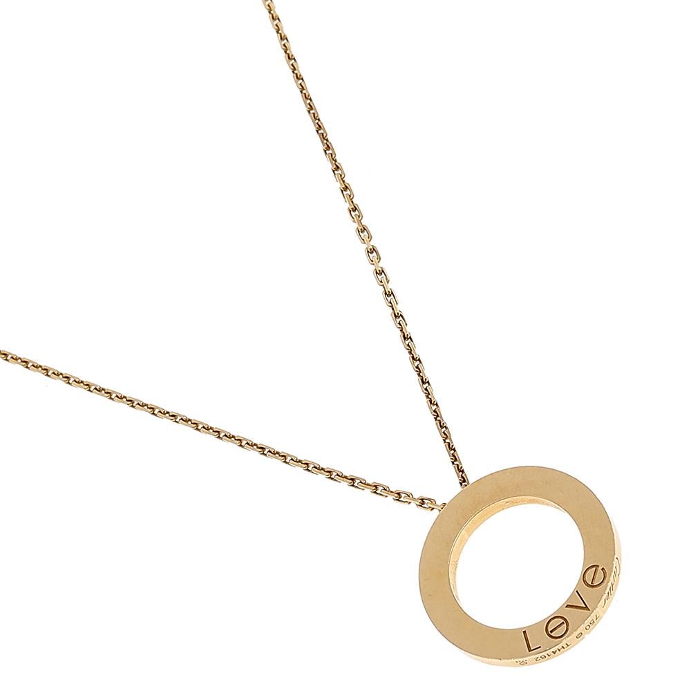 This radiant Love necklace from Cartier is a timeless piece that will be cherished for years to come! It has been crafted from 18K yellow gold and features a chain-link carrying a ring pendant detailed with the iconic screw motifs—a Cartier symbol
