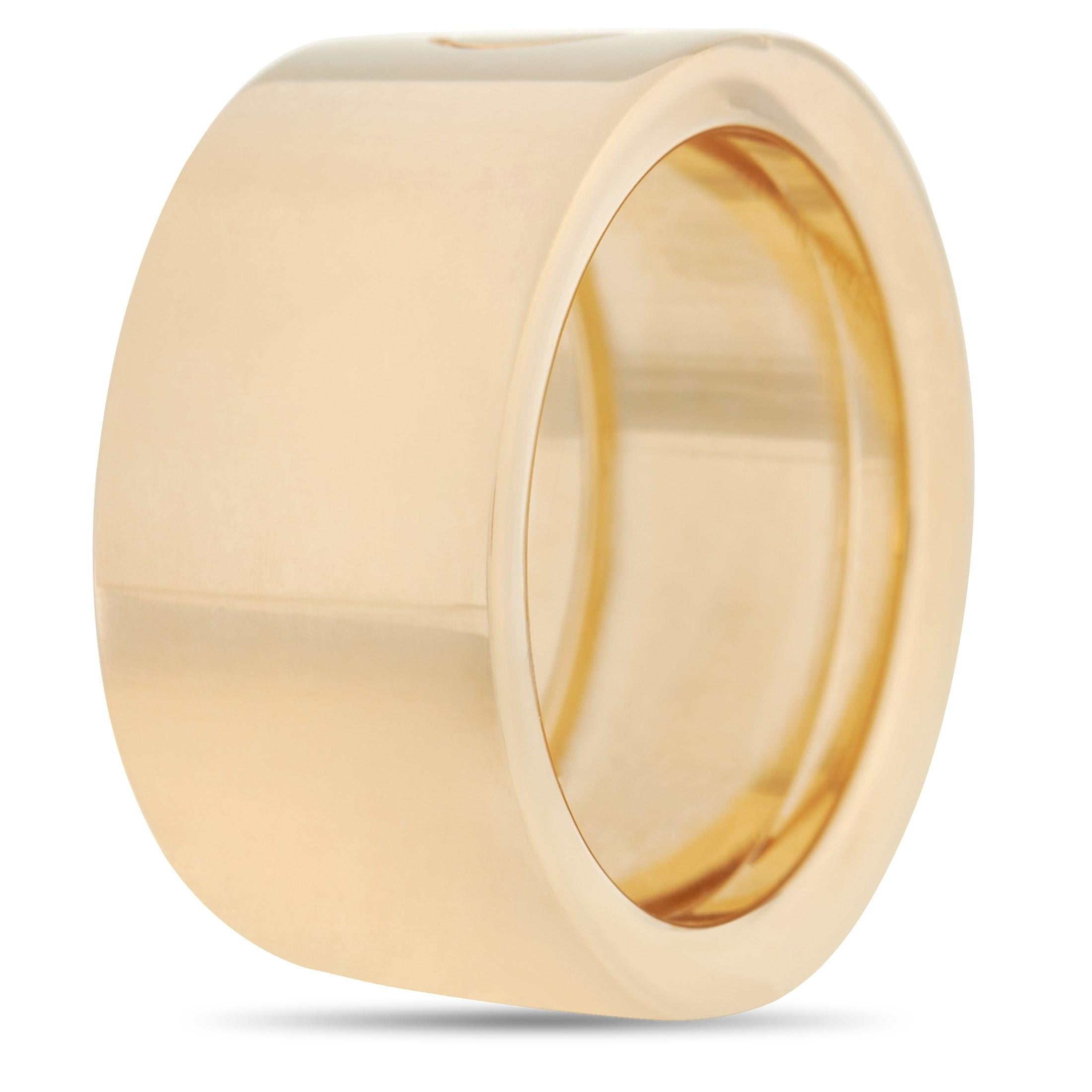 This bold Cartier Love 18K Yellow Gold Screw Ring is a classic Cartier ring. The simple band is made with 18K yellow gold and features the iconic Cartier screw motif in the center of the band. The inside of the band is inscribed with the brand name.